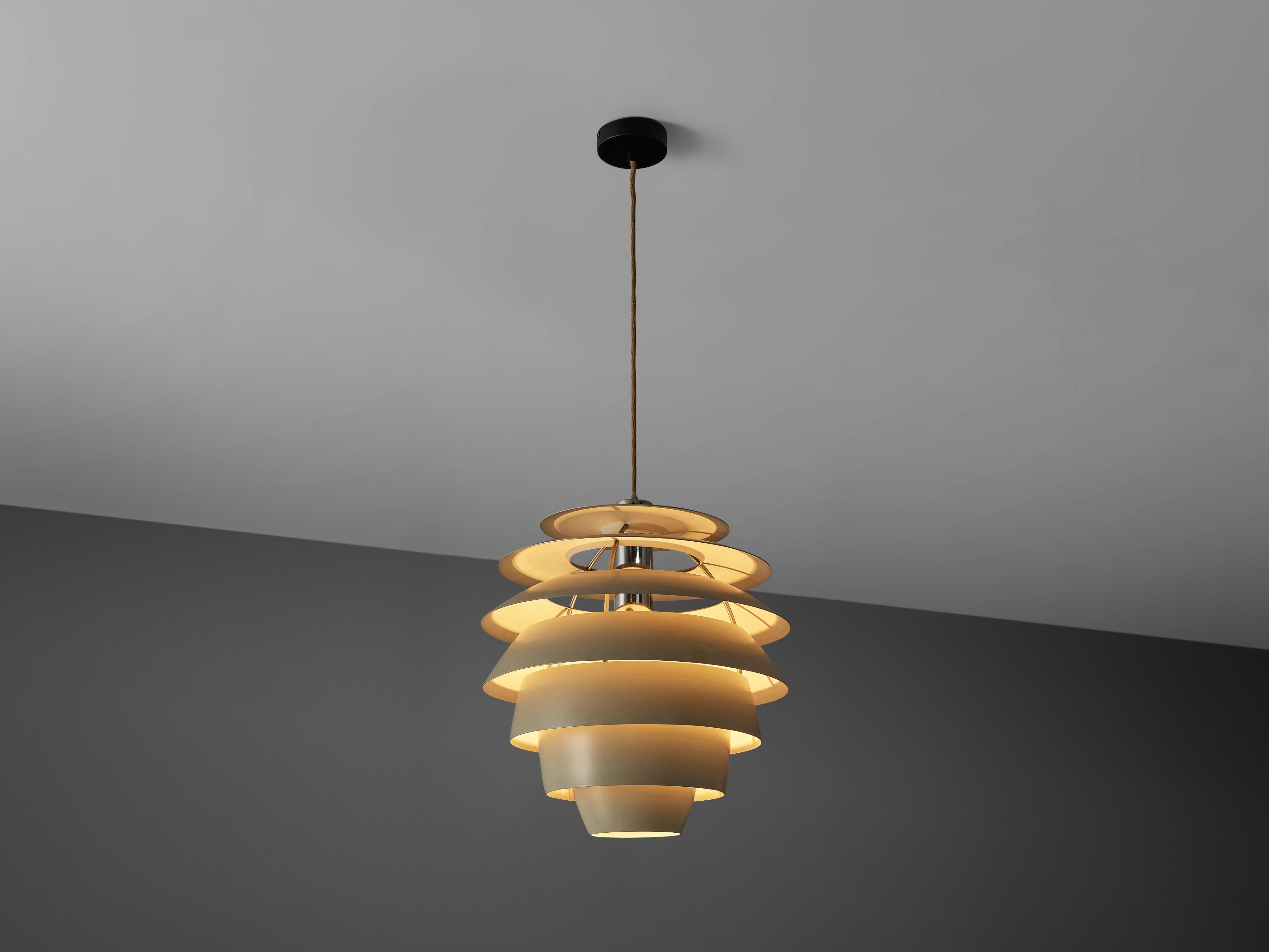 Stilnovo, pendant model '1231', white lacquered metal, Italy, 1960s

This Stilnovo pendant has the shape of a 'beehive' and is build out of several layers. Due to the shades position and shape the chandelier hides the direct light source and thus