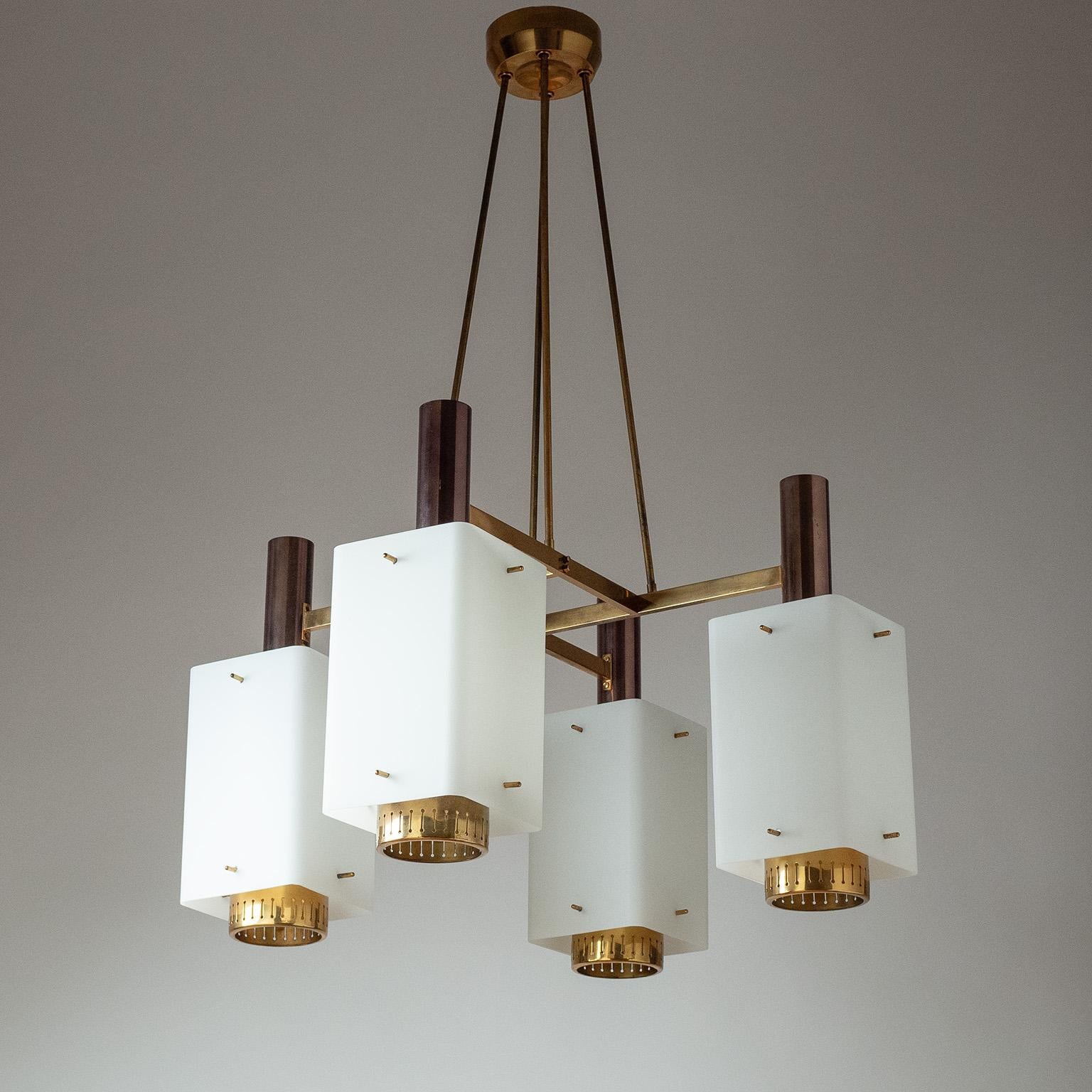 Large Stilnovo chandelier from the 1950s. Polished brass structure (partially patinated in a darker hue) with large satin glass diffusers and brass finials Very nice original condition with some patina on the brass stems. Four original brass and