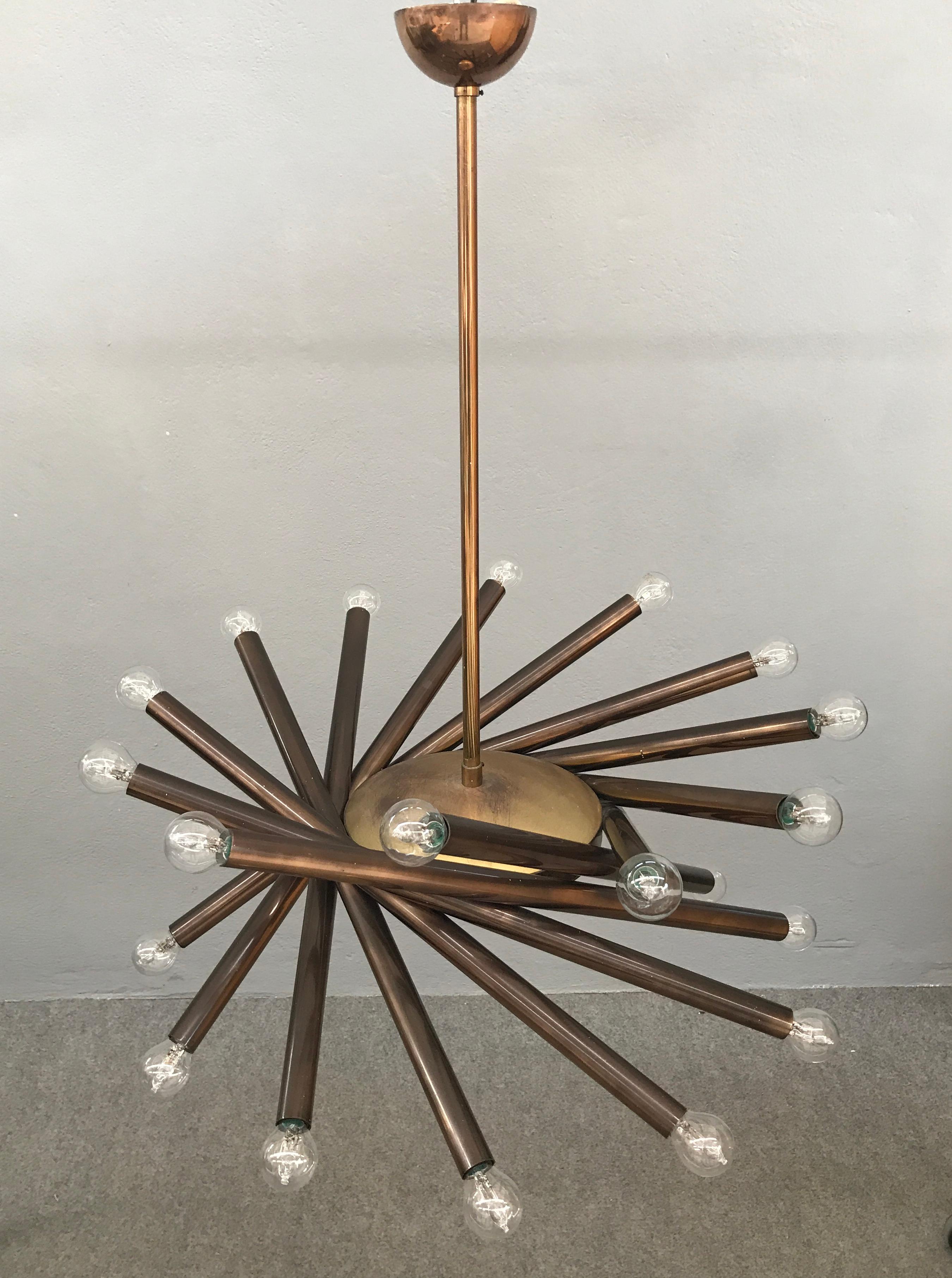 Rare brass chandelier with 24 lights and central solid brass round dish by Stilnovo, circa 1950.