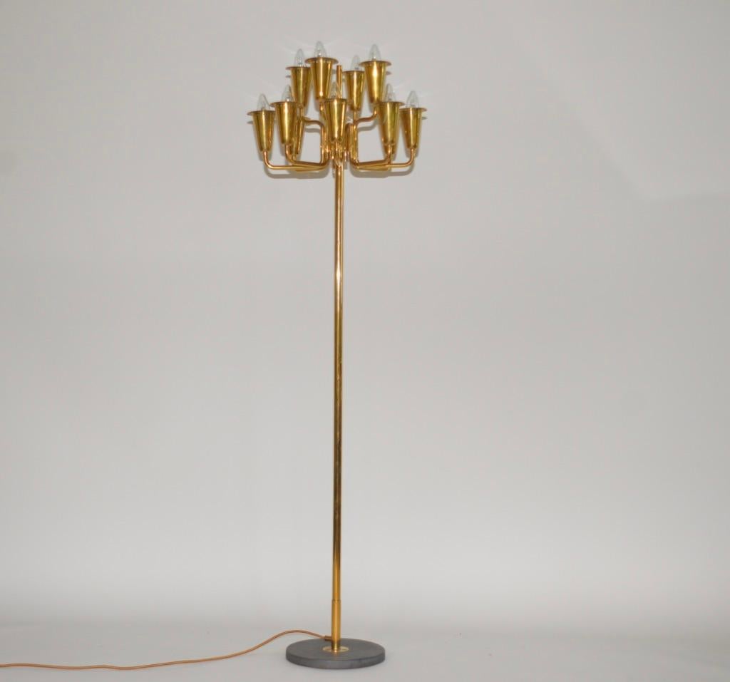 Stilnovo Italian brass floor lamp designed by Sciolari for this prestigious brand in the 1950s. This impressive lamp has a solid brass frame and has a solid marble base. The lamp has been newly
re-wired using gold silk cable. A very striking item.