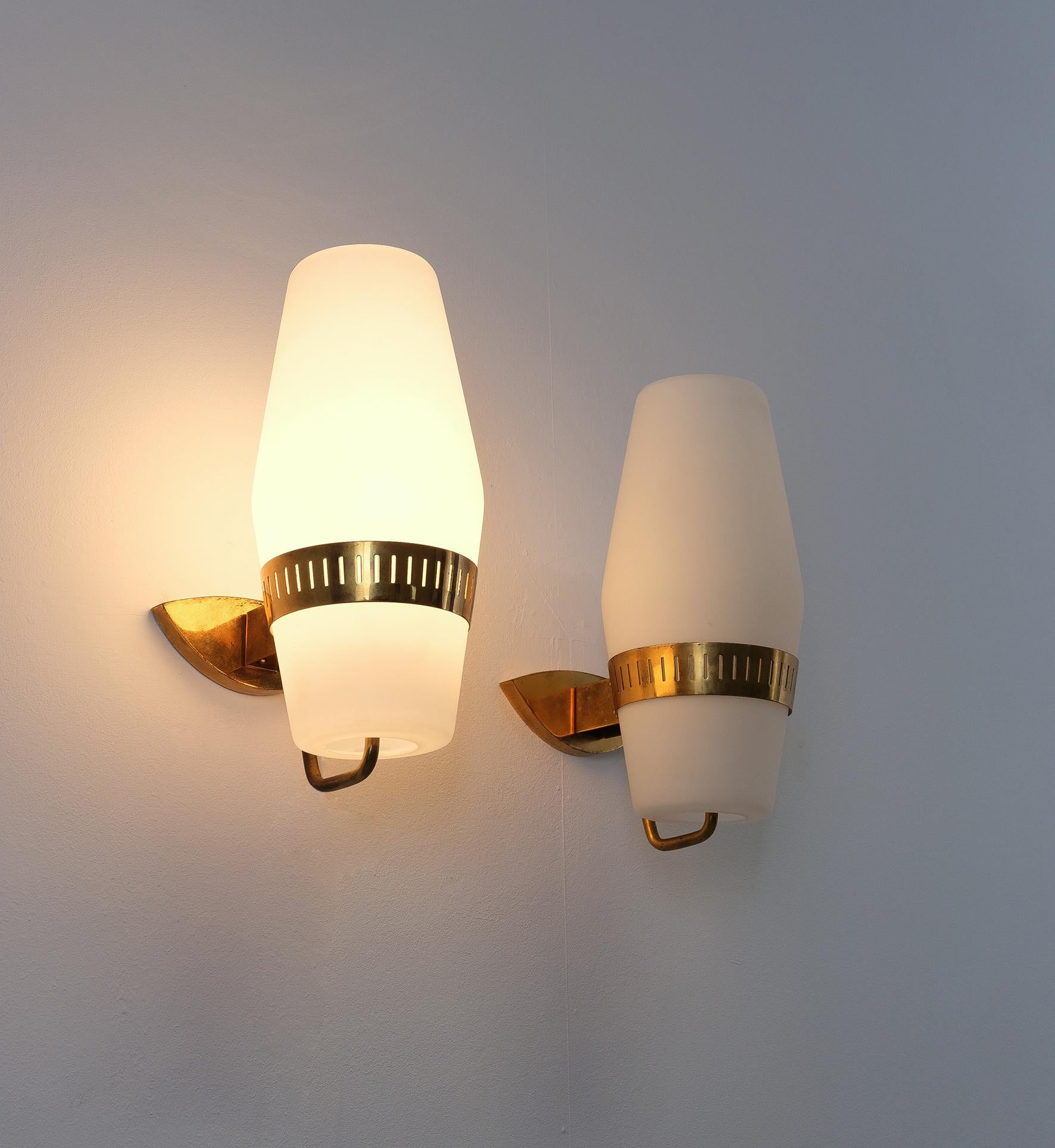 Stilnovo Bruno Gatta Mod. 2078 Glass Brass Wall Lights, Italy, 1959
We have 4 wall lights available, they are priced per pair (2)
Dimensions are 14.5“ x 8.66“ x 6.3“

Formidable set of four large wall lights with brass hardware and opal glass