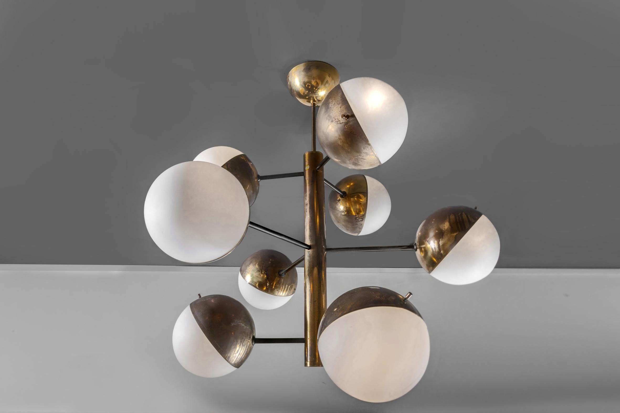 A Stilnovo production ceiling lamp in a beautiful vintage patina. 
Brass structure with opaline glass.
  