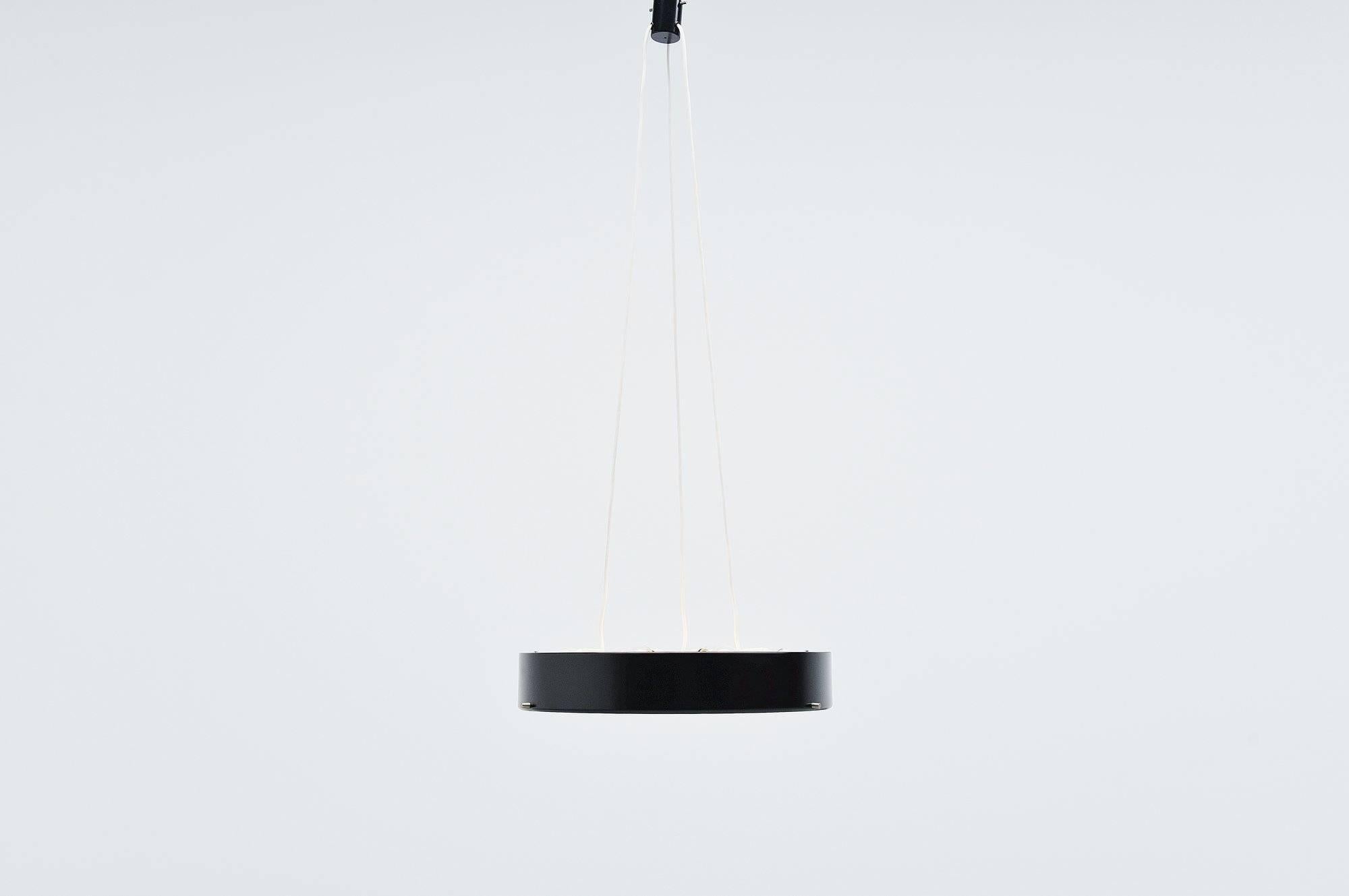 Nice large minimalist ceiling lamp model 288 designed by Bruno Gatta for Stilnovo, Italy 1959. This is for a very nice modernist shaped ceiling pendant lamp with a black lacquered aluminium shade, and a large white opaline glass diffuser shade. The