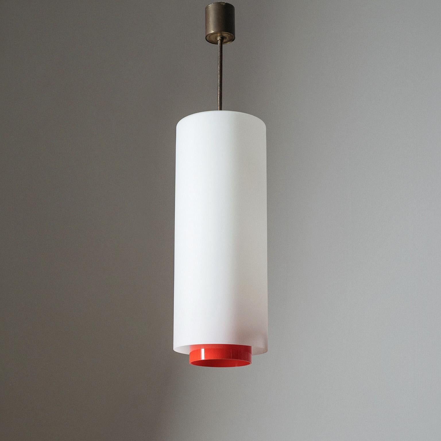 Rare Stilnovo ceiling light or lantern with a long satin glass diffuser, bright red acrylic shade and brass hardware from the 1950s. Four original brass and ceramic E14 sockets with new wiring. Original manufacturers label.
Measures: Height 75cm