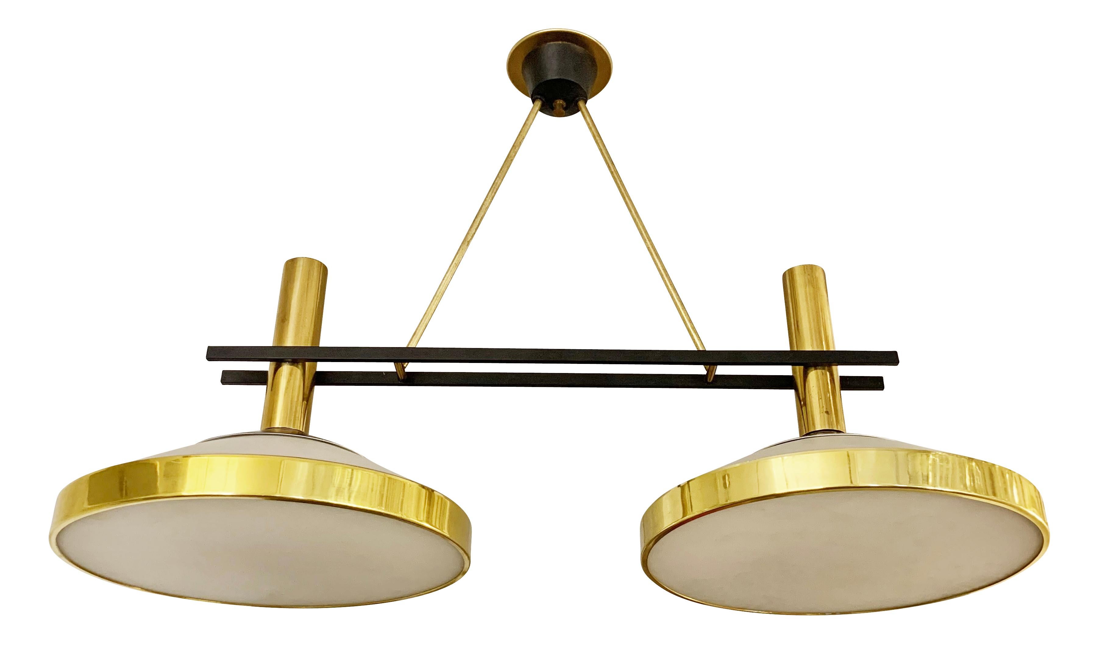 Italian midcentury ceiling light by Stilnovo. Features two frosted glass shades with brass frames and black detailing. Ideal over a kitchen island or dining table.

Condition: Excellent vintage condition, minor wear consistent with age and