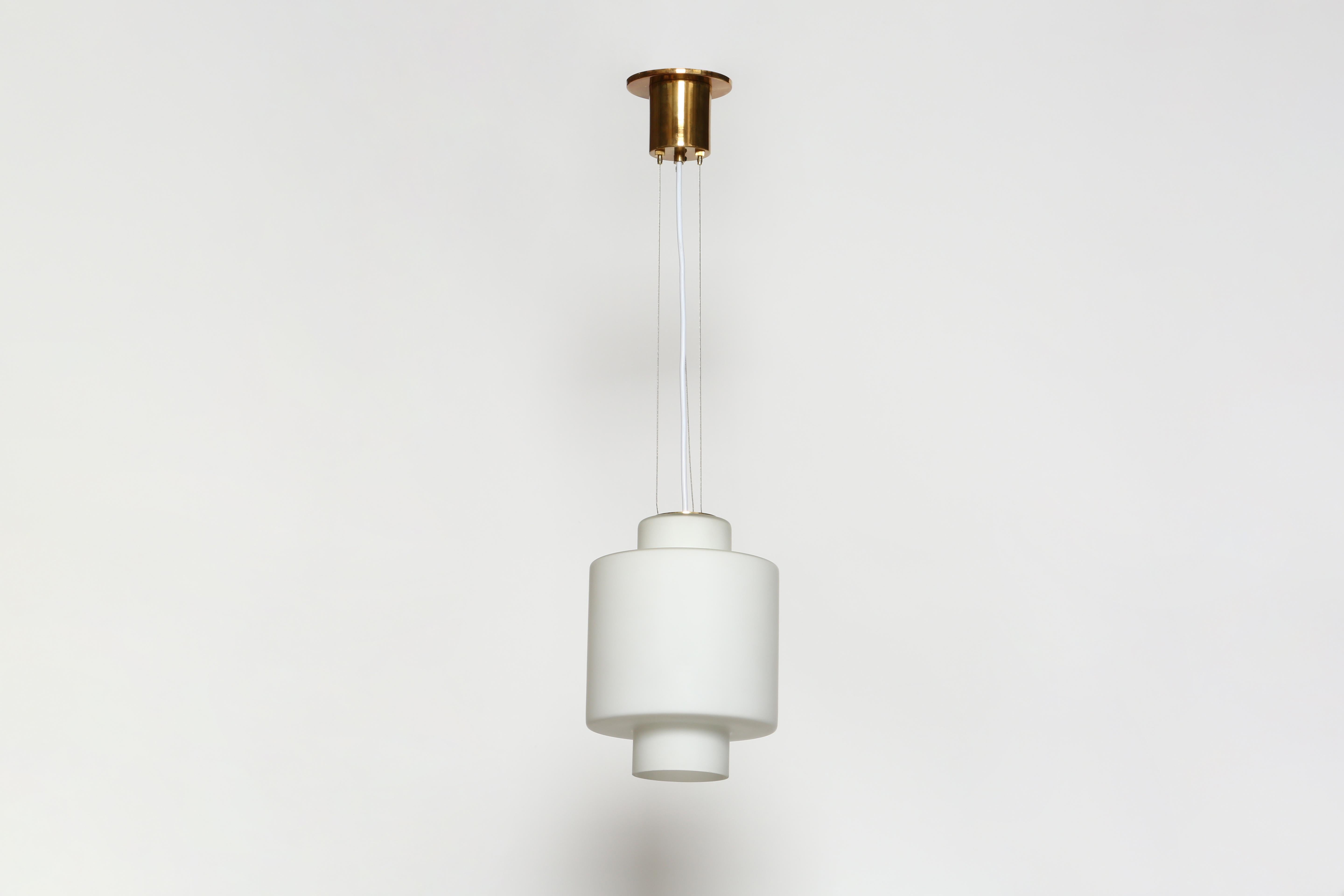 Stilnovo ceiling pendant
Designed and made in Italy, 1960s
Opaline glass, brass
Rewired for US
Takes one medium base bulb 
Overall drop is adjustable.
Height of the glass is 12 inches