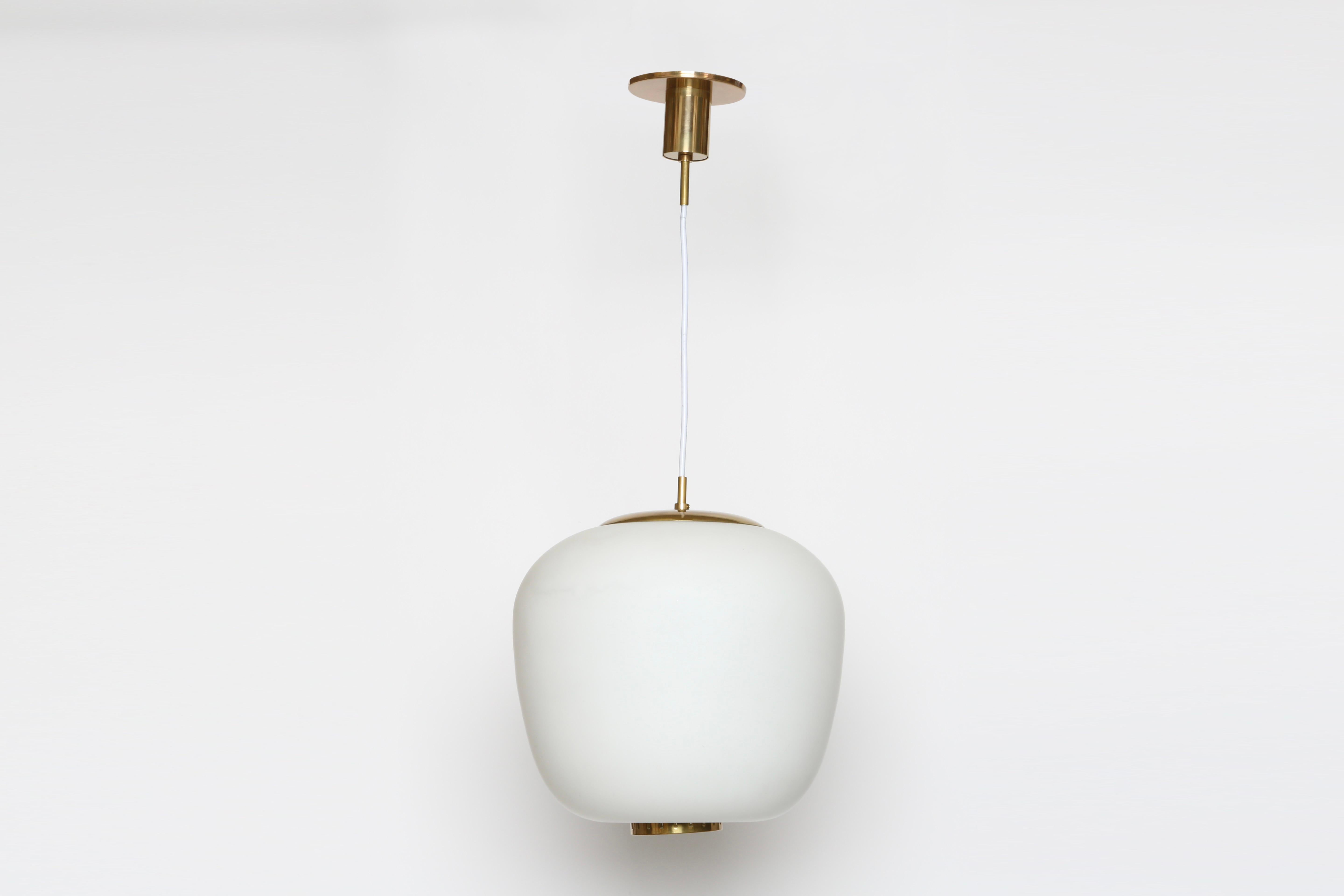 Stilnovo ceiling pendant
Designed and made in Italy, 1960s
Opaline glass, textured glass diffuser.
Rewired for US.
Takes one medium base bulb. 
Overall drop is adjustable.
Height of the glass is 13.5 inches.
Beautifully refinished brass.

We take