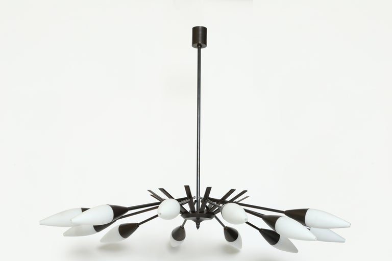 Stillovo chandelier ( attributed) with 12 lights.
Patinated brass branches with matte opaline glass.