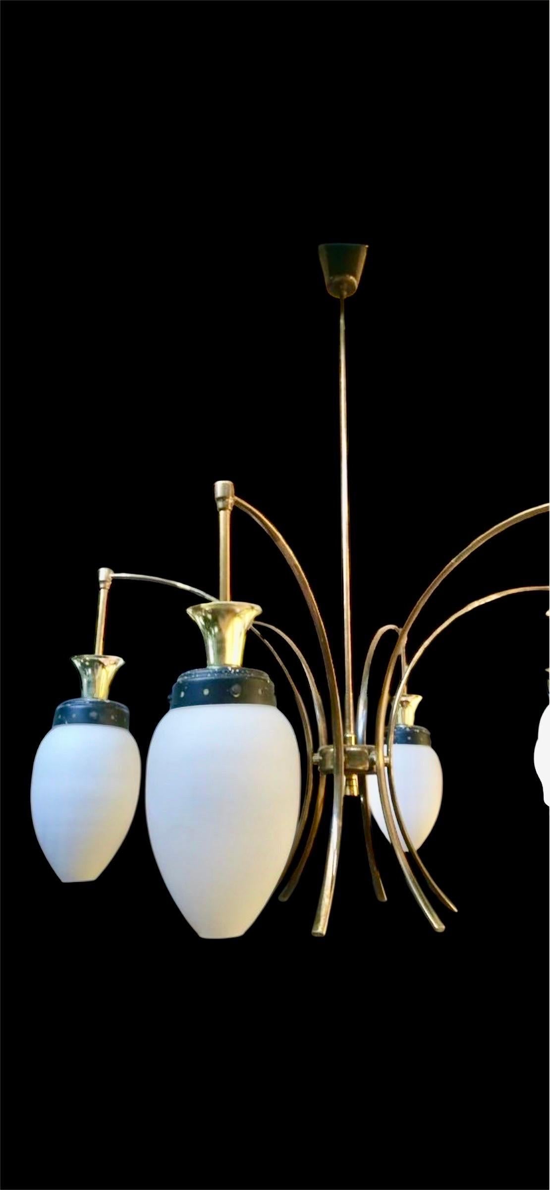 A Stilnovo chandelier with opaline glass refers to a vintage or mid-century modern Italian lighting fixture, typically crafted in the 1950s to 1970s, known for its elegant use of opaline (milky, translucent) glass shades with brass or mixed metal