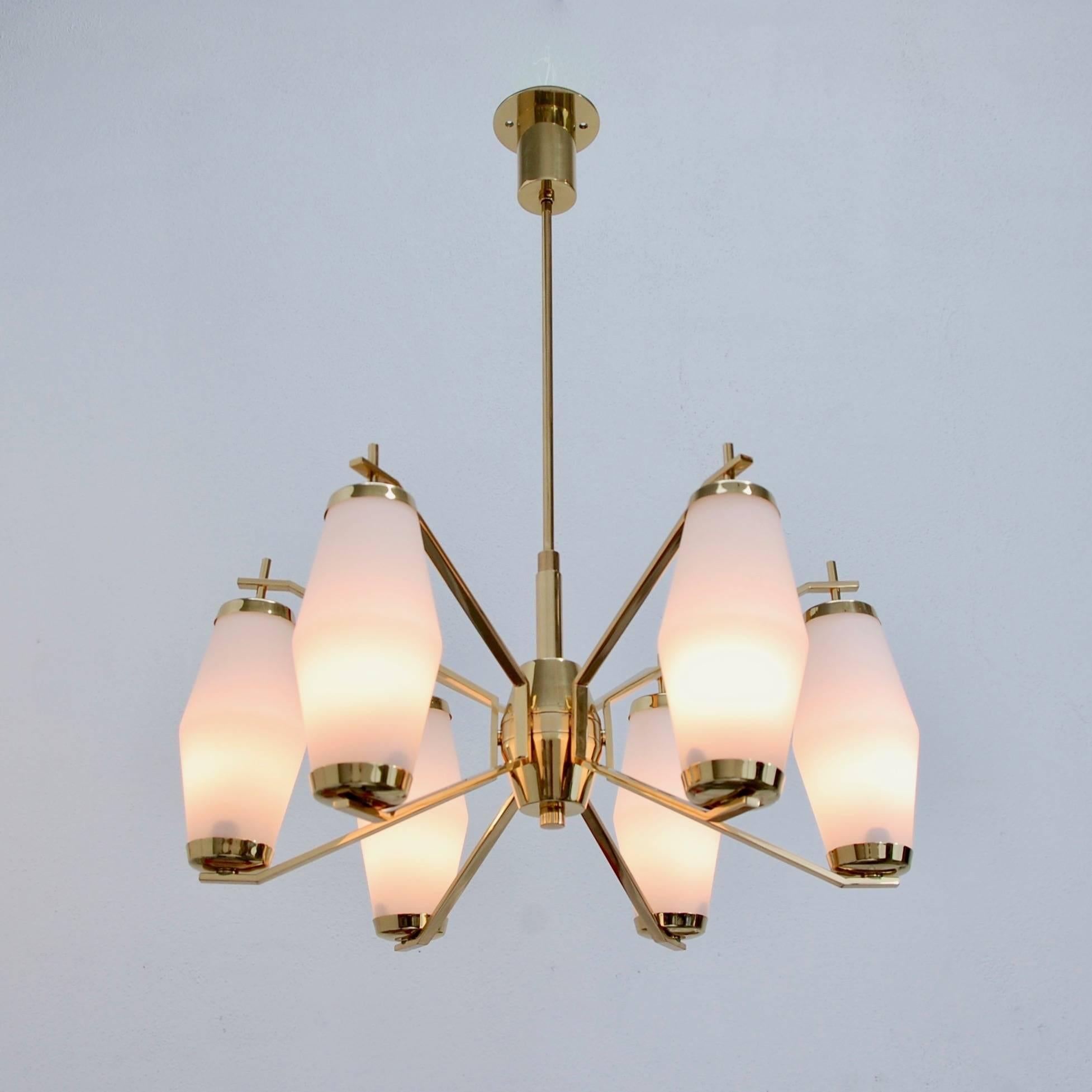 Vibrant Stilnovo six shade brass and glass chandelier from 1950s, Italy. Fully restored and rewired for use in the US. Patina lacquered brass finish.
Measures: Fixture Height 11”
Diameter 23”
OAD 29”.
 