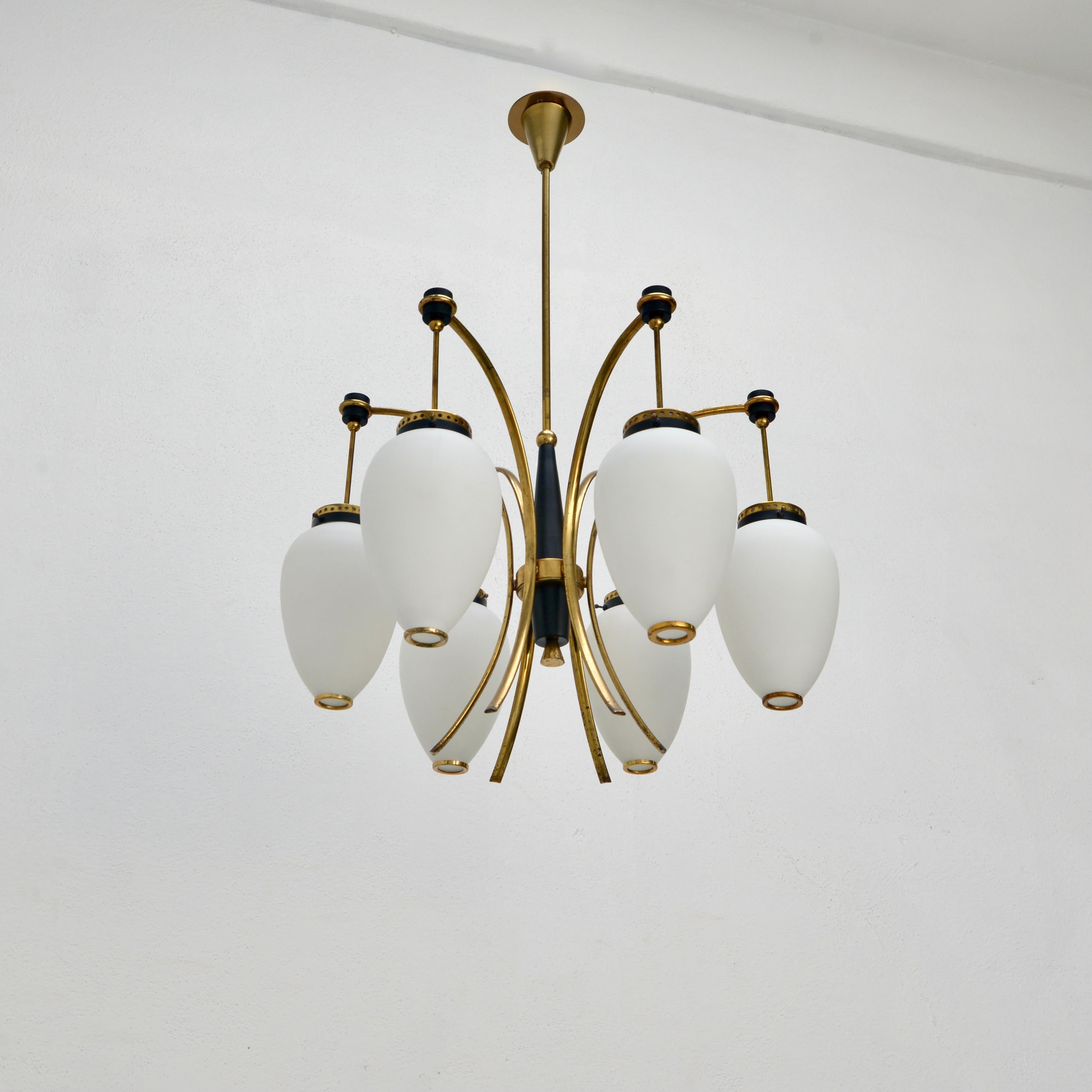 Stilnovo of the period mid century Italian 6 globe 1950s naturally aged brass chandelier with hand blown glass shades. Wired with 1-E12 candelabra based sockets (1) per globe shade (6 in total). Wired for use in the US. Light bulbs included with