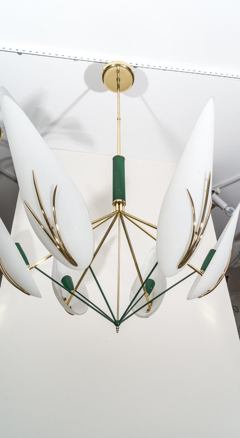 This stylish and chic Mid-Century Modern Stilnovo chandelier will make a subtle understated impact with it form and use of materials.

Note: The brass has been professionally polished and lacquered, so no tarnishing.

Note: The piece has been