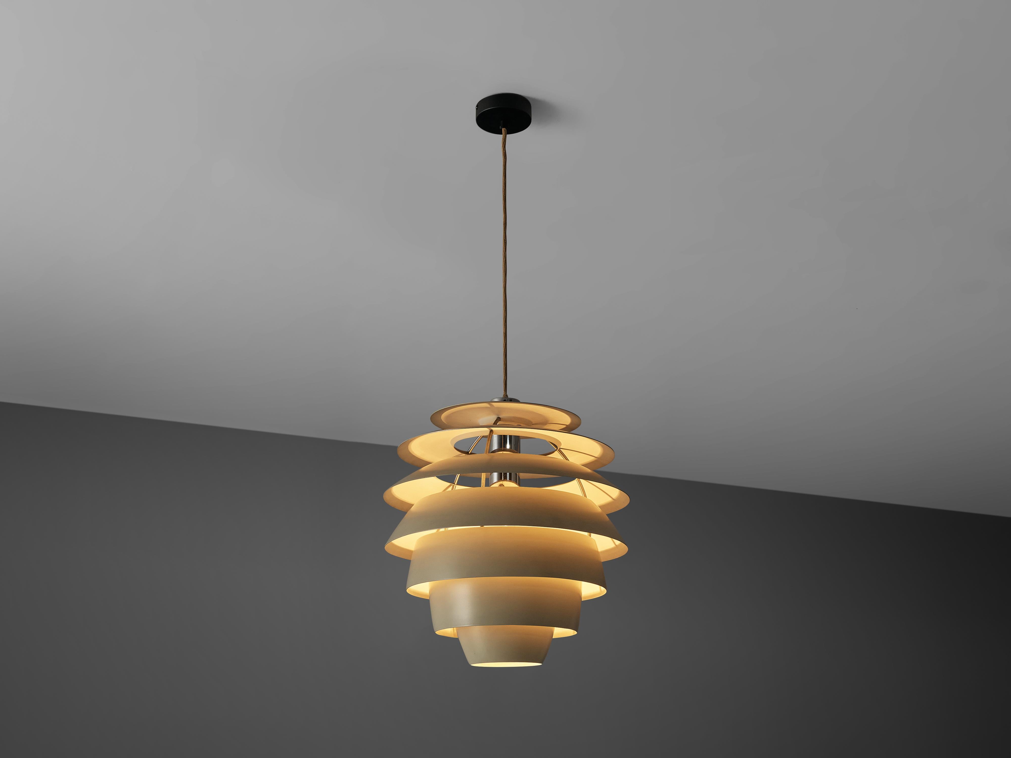 Stilnovo, pendant model 1231, white lacquered metal, Italy, 1960s

This Stilnovo pendant has the shape of a 'beehive' and is build out of several layers. Due to the shades position and shape the chandelier hides the direct light source and thus
