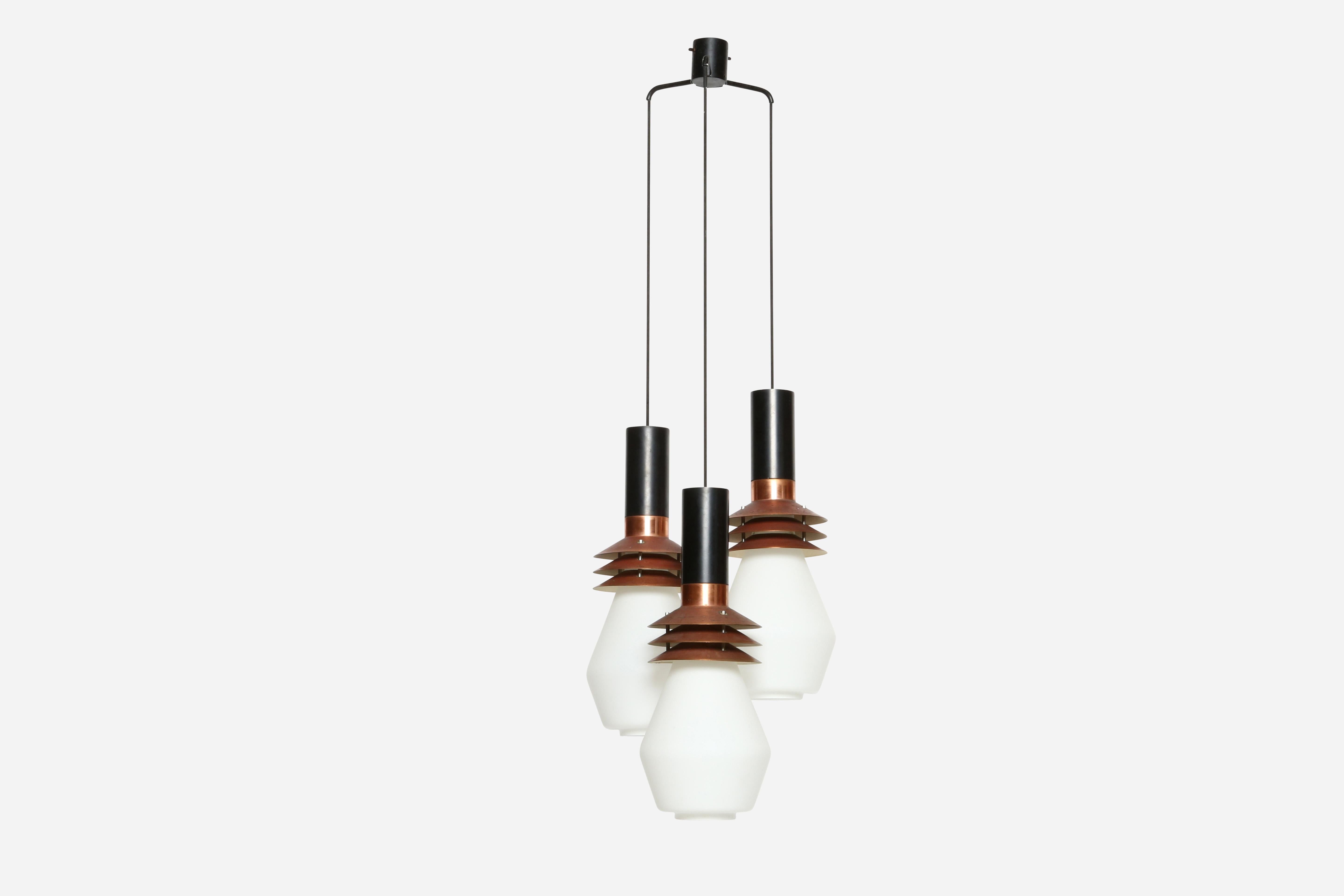 Stilnovo chandelier model 1253
Copper, enameled metal, matte opaline glass.
Three very large glass bells suspended on black cords.
Rare fixture with Stilnovo label.
Body of the pendants is 20.5 inches in height and 8 inches in diameter,
Designed and