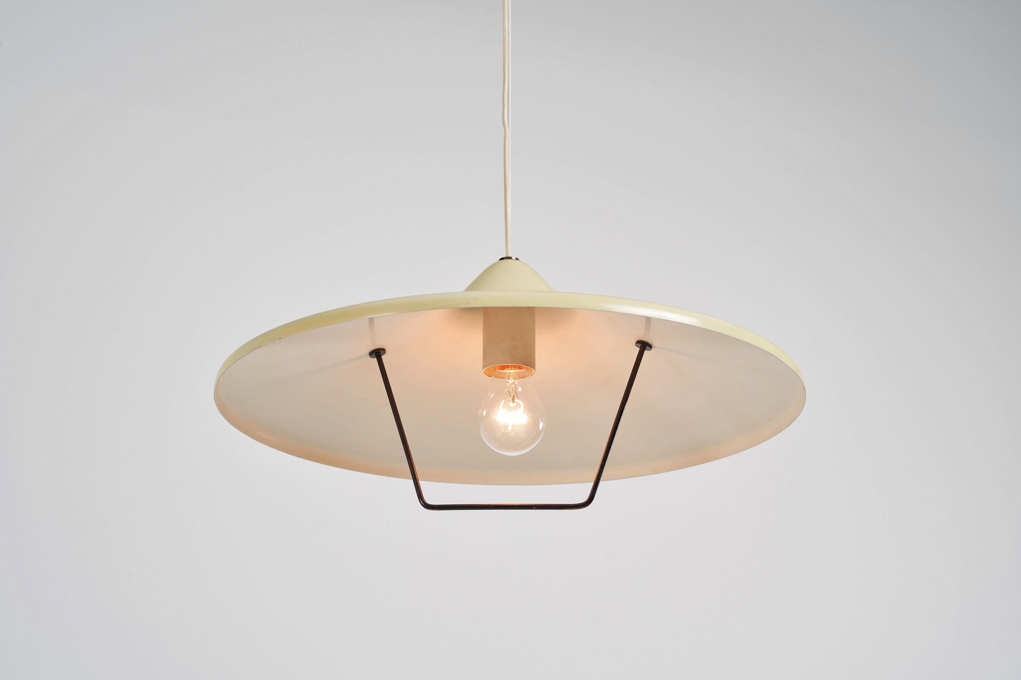 Rare counterbalance pulley pendant lamp designed and manufactured by Stilnovo, Italy 1955. This pendant lamp has the ability to easily change height and can serve more purposes on 1 place. Due to an ingenious pully system the lamp can be pulled down