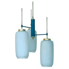 Stilnovo designer pendant light in opaline glass and metal dating from the 1960s