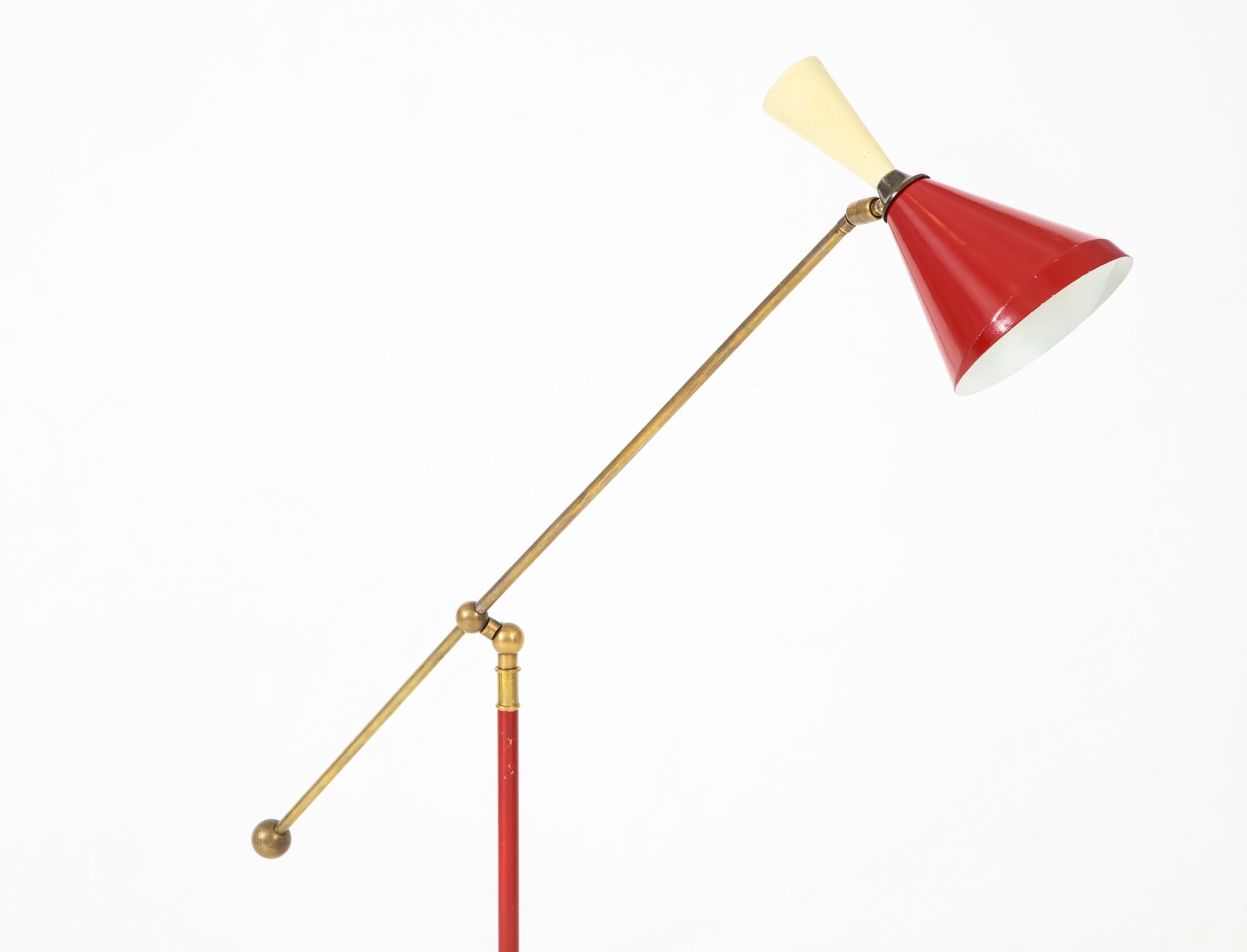 An Italian Stilnovo Diabolo red and cream paint, brass and marble floor lamp, mid-20th century, Striking color combination, nice surfaces on both the paint and brass, clean white marble base with minor chips. Restored. Fully rewired for the