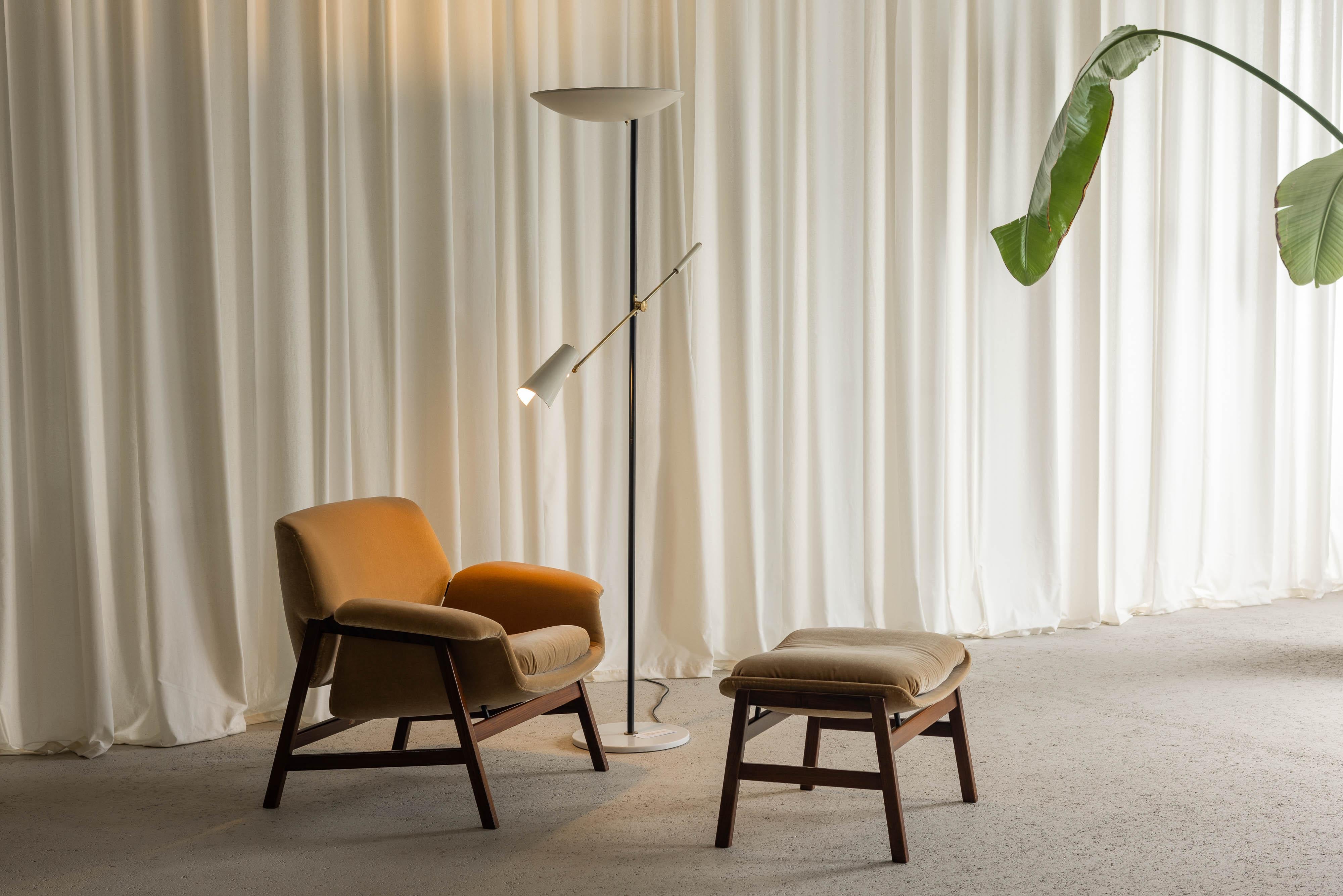 This elegant floor lamp designed by Bruno Gatta and manufactured by Stilnovo is a stunning example of mid-century Italian design, featuring both form and function in its sophisticated aesthetic. The lamp is designed with an uplighter shade that