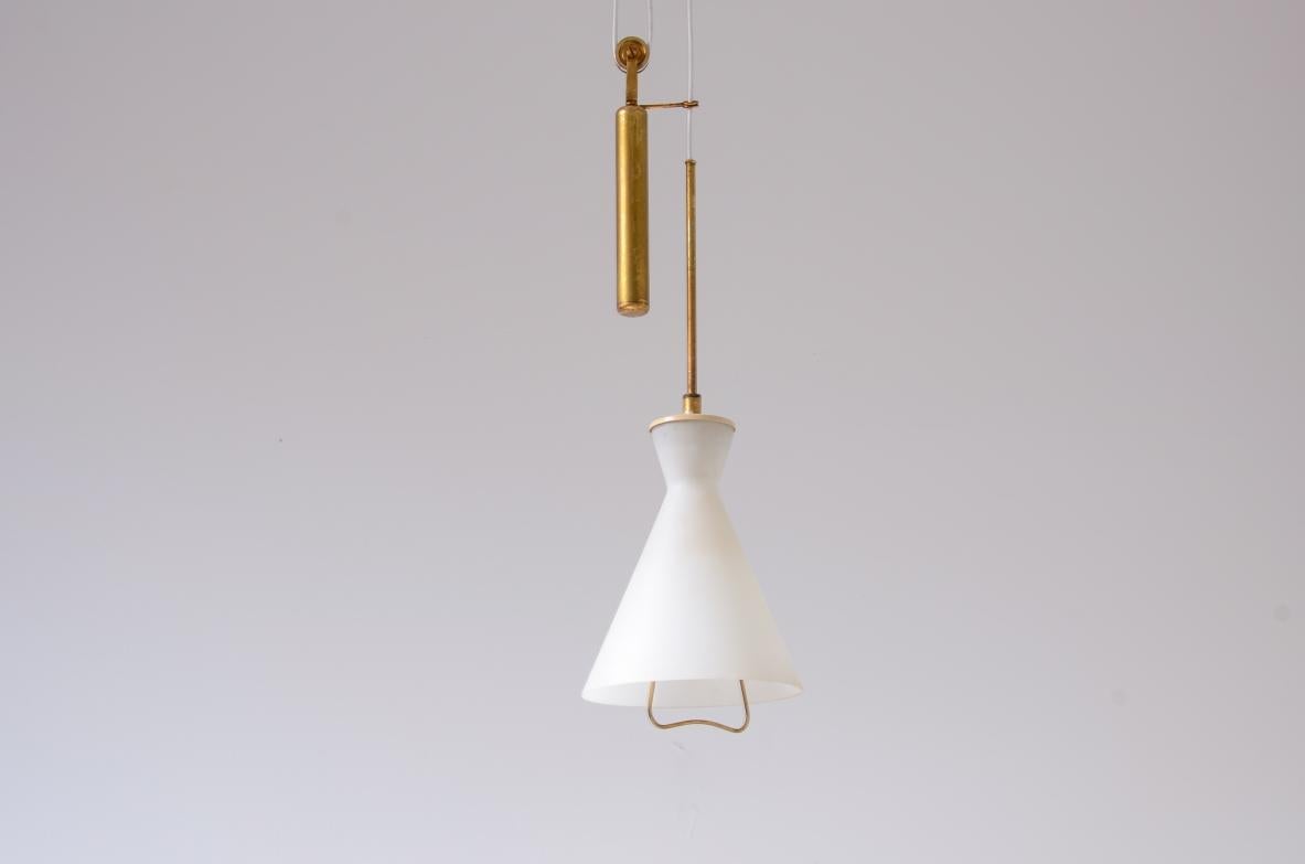 Italian Stilnovo elegant brass and opaline glass bell-shaped chandelier. For Sale