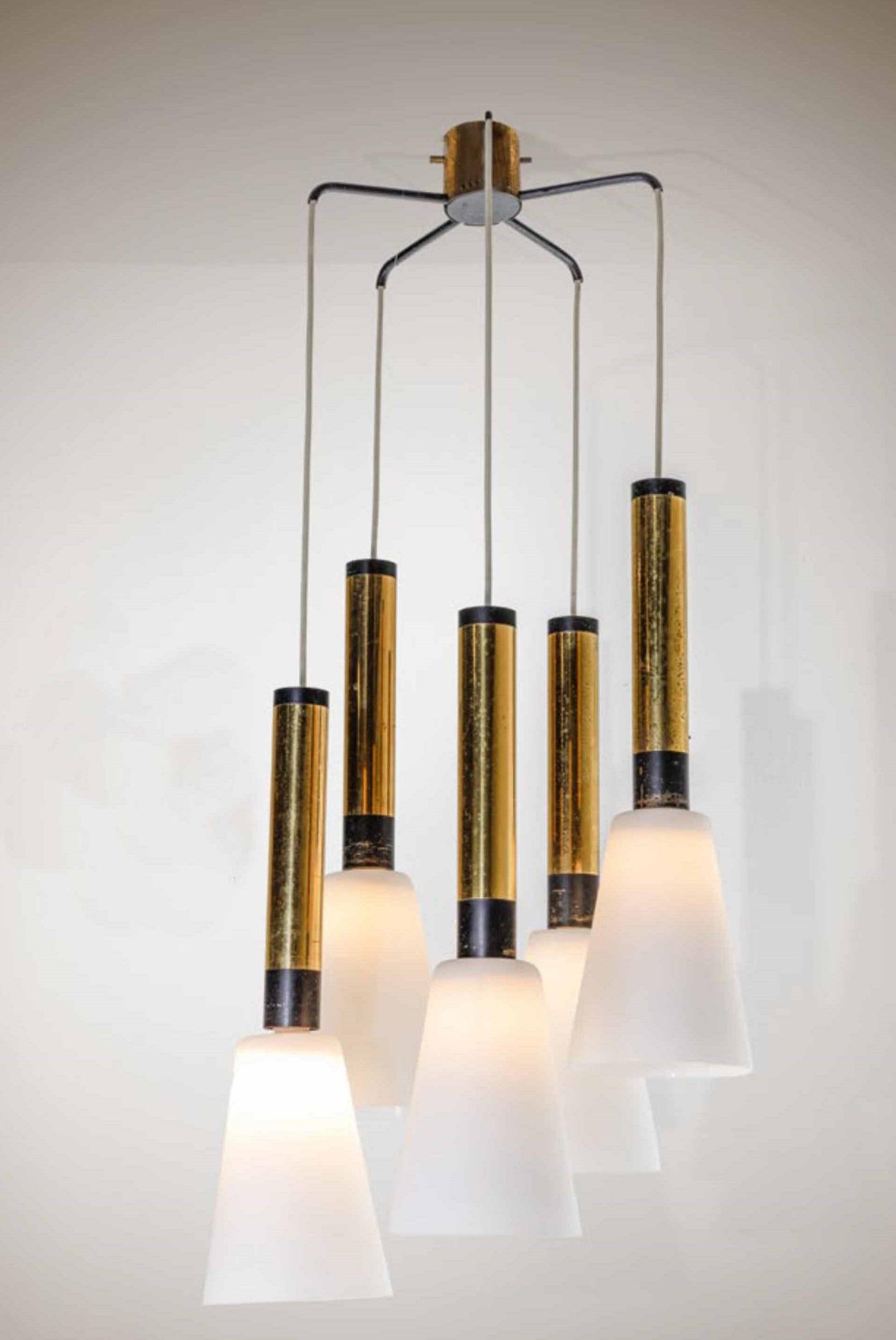 Ceiling lamp or chandelier with structure in lacquered metal and brass and five diffusers in opaline glass.
This chandelier was manufactured by the Italian company Stilnovo during the 1960s.

Stilnovo was an important lighting company founded by