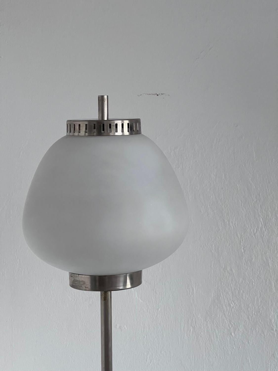 Mid-Century Modern Lamp - Stilnovo Floor Lamp - Collectible Italian Light

Rare floor lamp by Italian manufacturer Stilnovo, made in the 1950s and crafted in steel, marble and opaline glass. A thin brushed steel stem holds an apple-shaped globe in