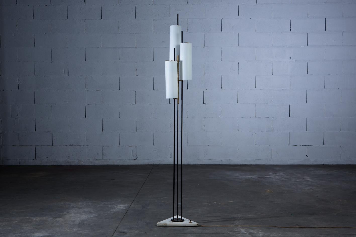 An elegant Stilnovo floor lamp from Italy in the 1950s. With a marble base, brass frame and three opaline glass cylinders. In good original vintage condition. Ships worldwide - please contact us directly for options.

Dimensions: D: 34cm x W: 38cm