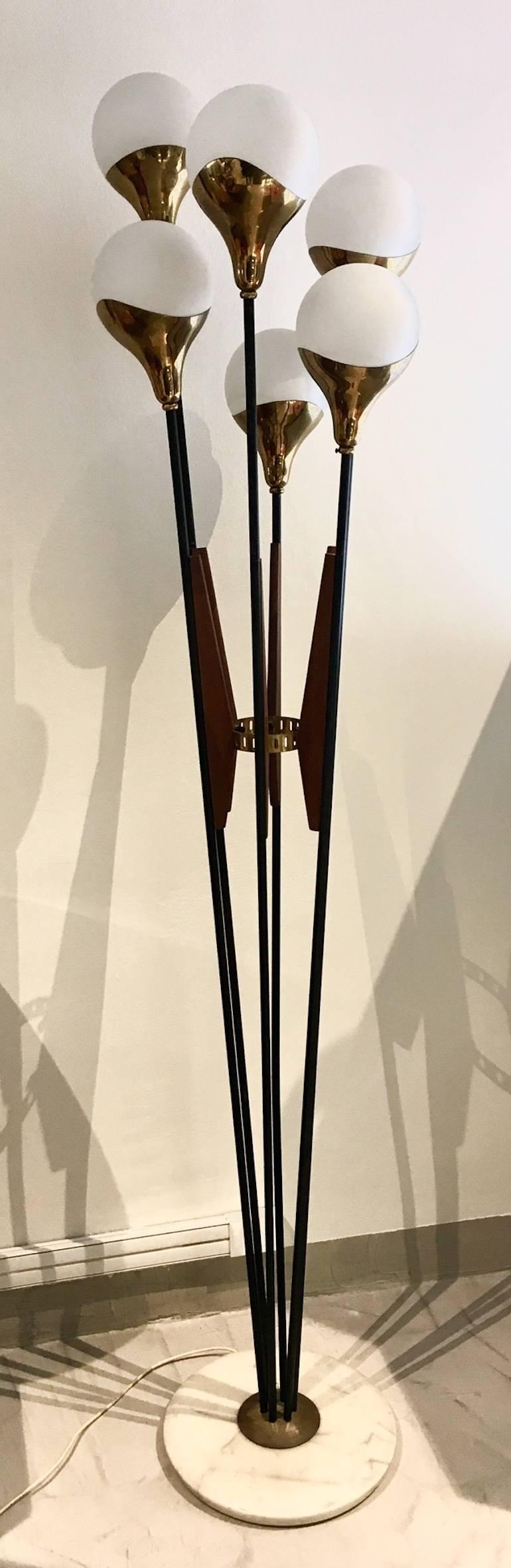 Elegant floor lamp with six lights produced by Stilnovo, Italy. Brass, varnished metal, white glass, wood. Marble base. Please note that there is a small dent in the base, pictured.