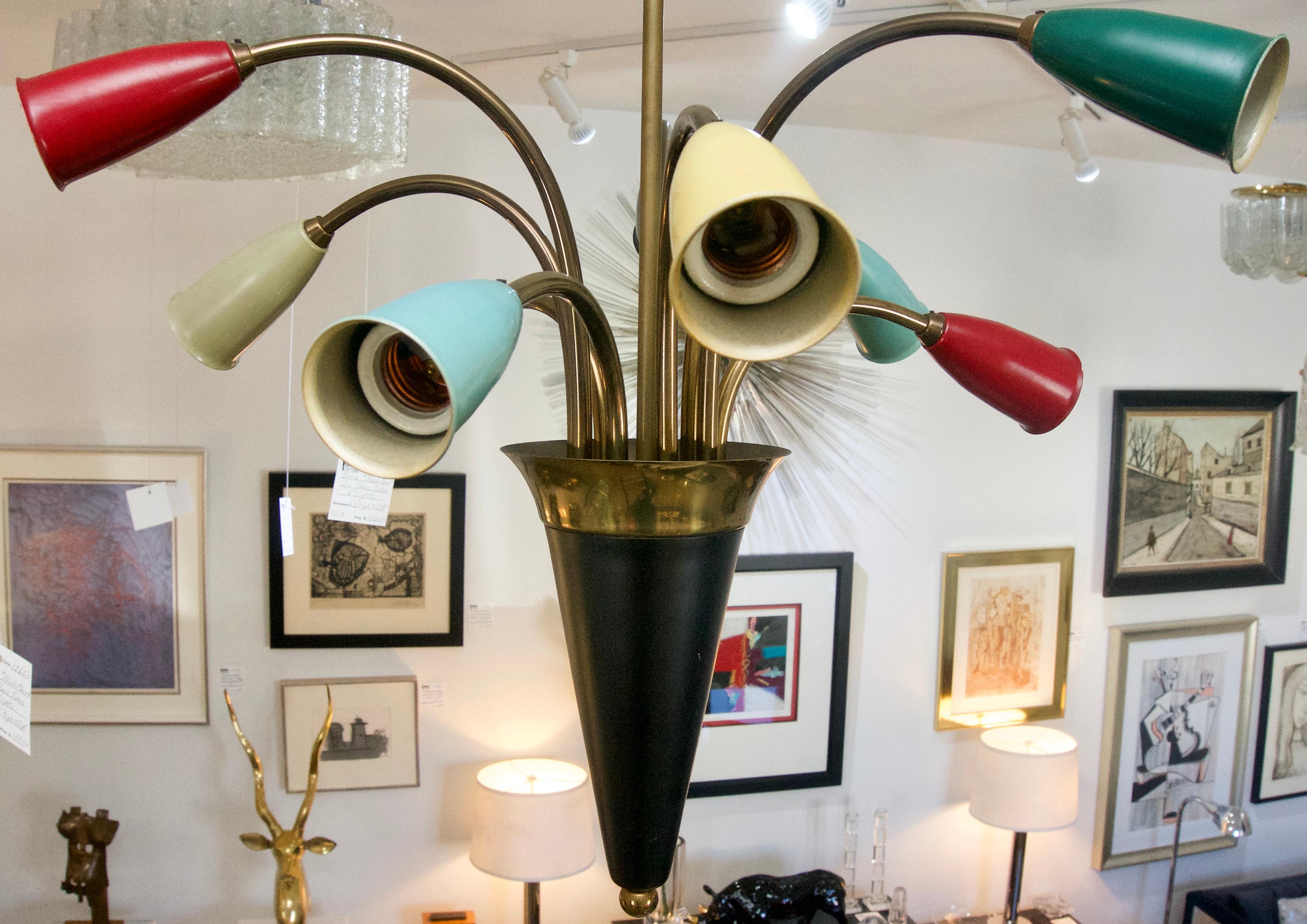 This stylish mid-century modern chandelier is very much in the style of pieces created by Stilnovo.

Note: Requires Edison based light bulbs. 