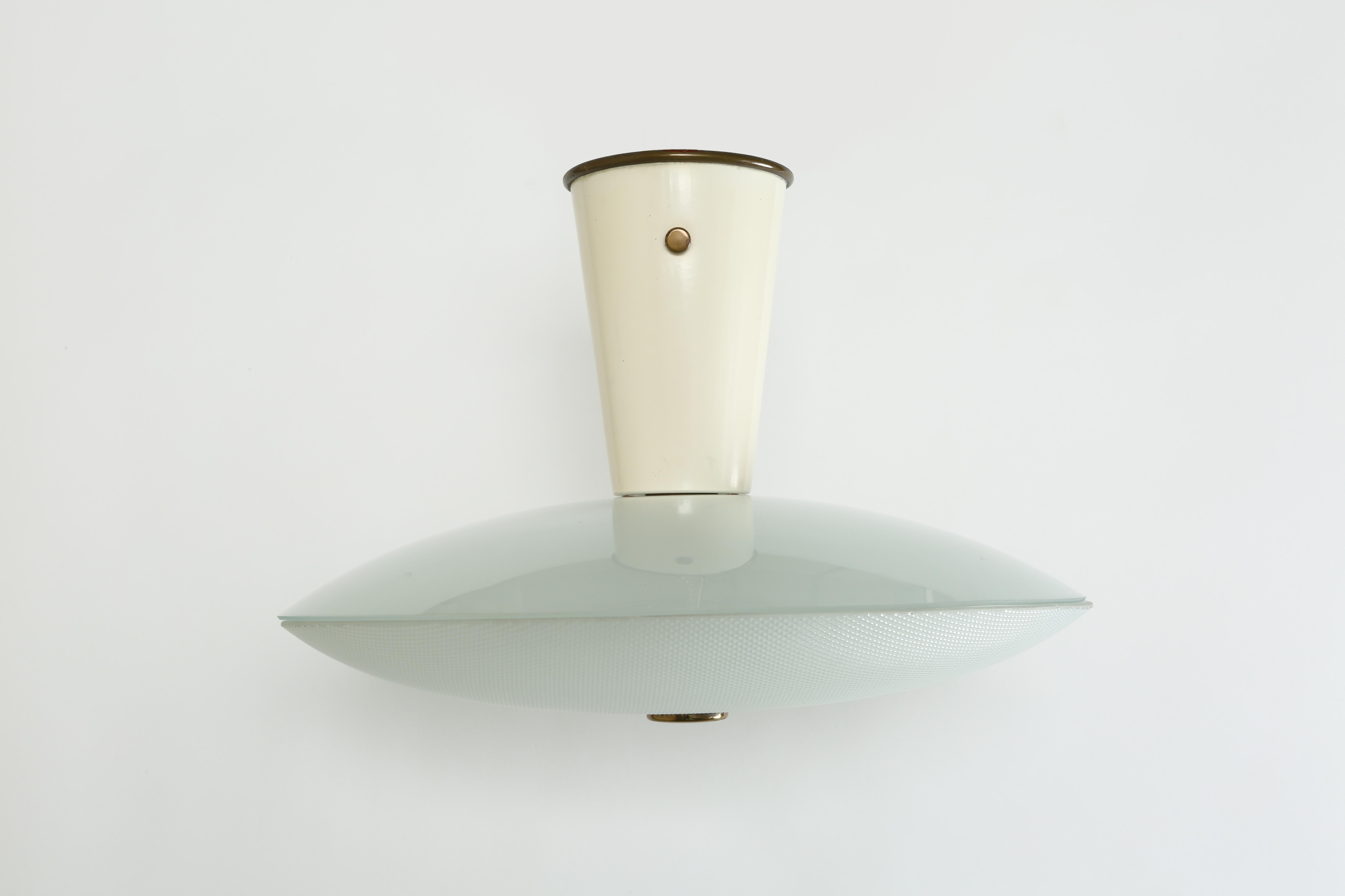 Stilnovo flush mount.
Consists of two pieces of hand blown glass, enameled metal, brass.
Stilnovo label.