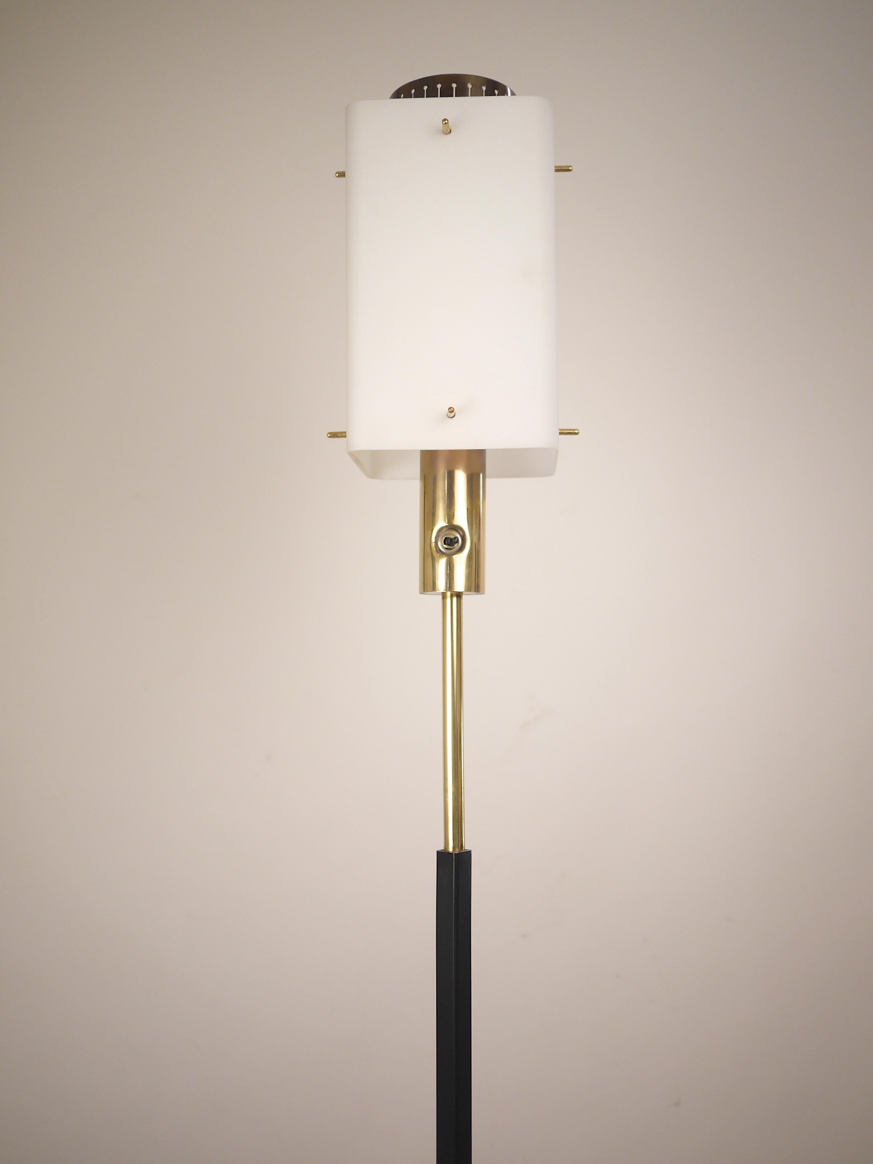 A 1960s Stilnovo floor lamp edited  in the 1950s. Opaline shade and brass element from top to base. Stilnovo label Excellent condition. Measures: Height 178 cm.
