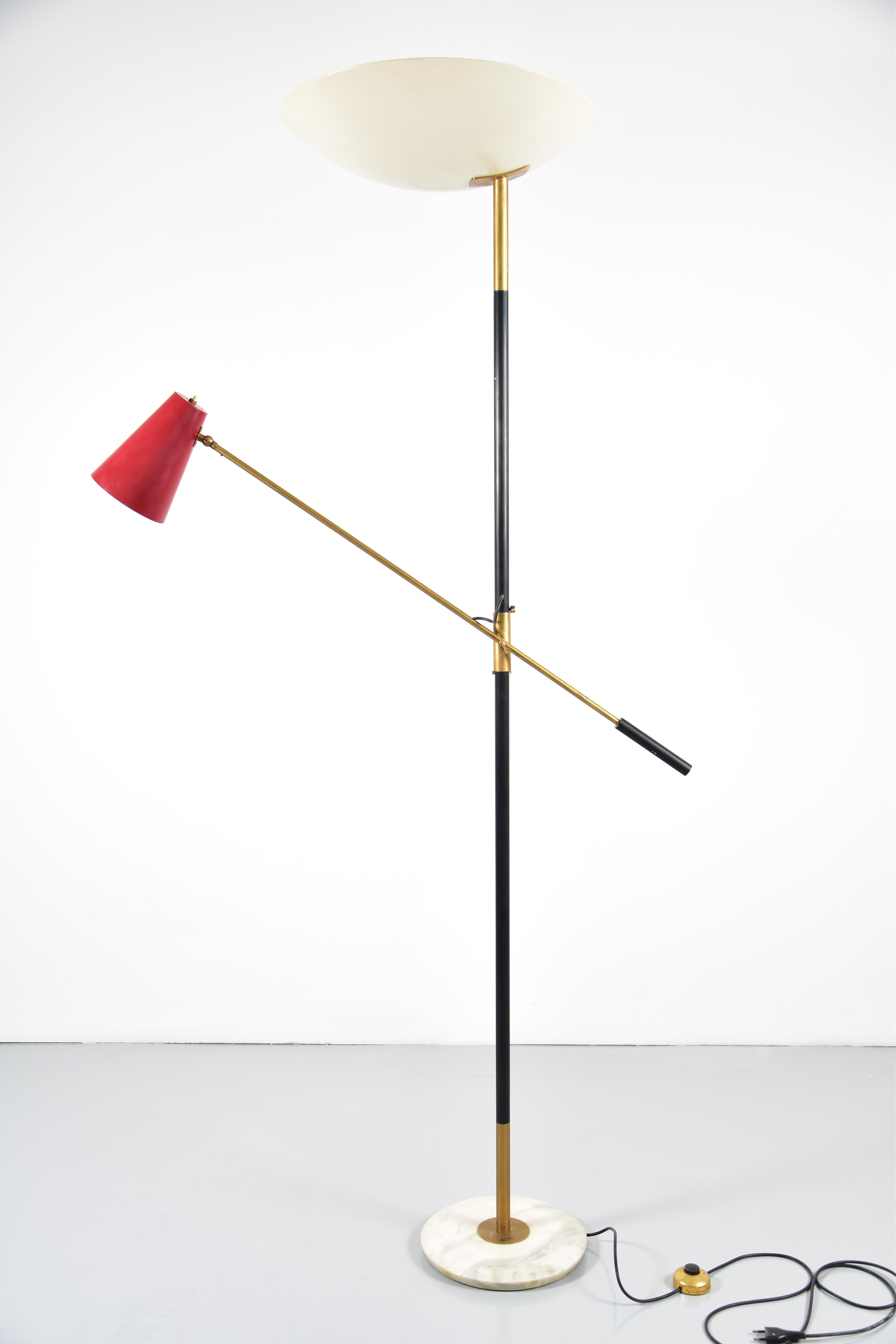 A rare Stilnovo adjustable floor lamp. Original painted metal shades with brass arms and a marble base.