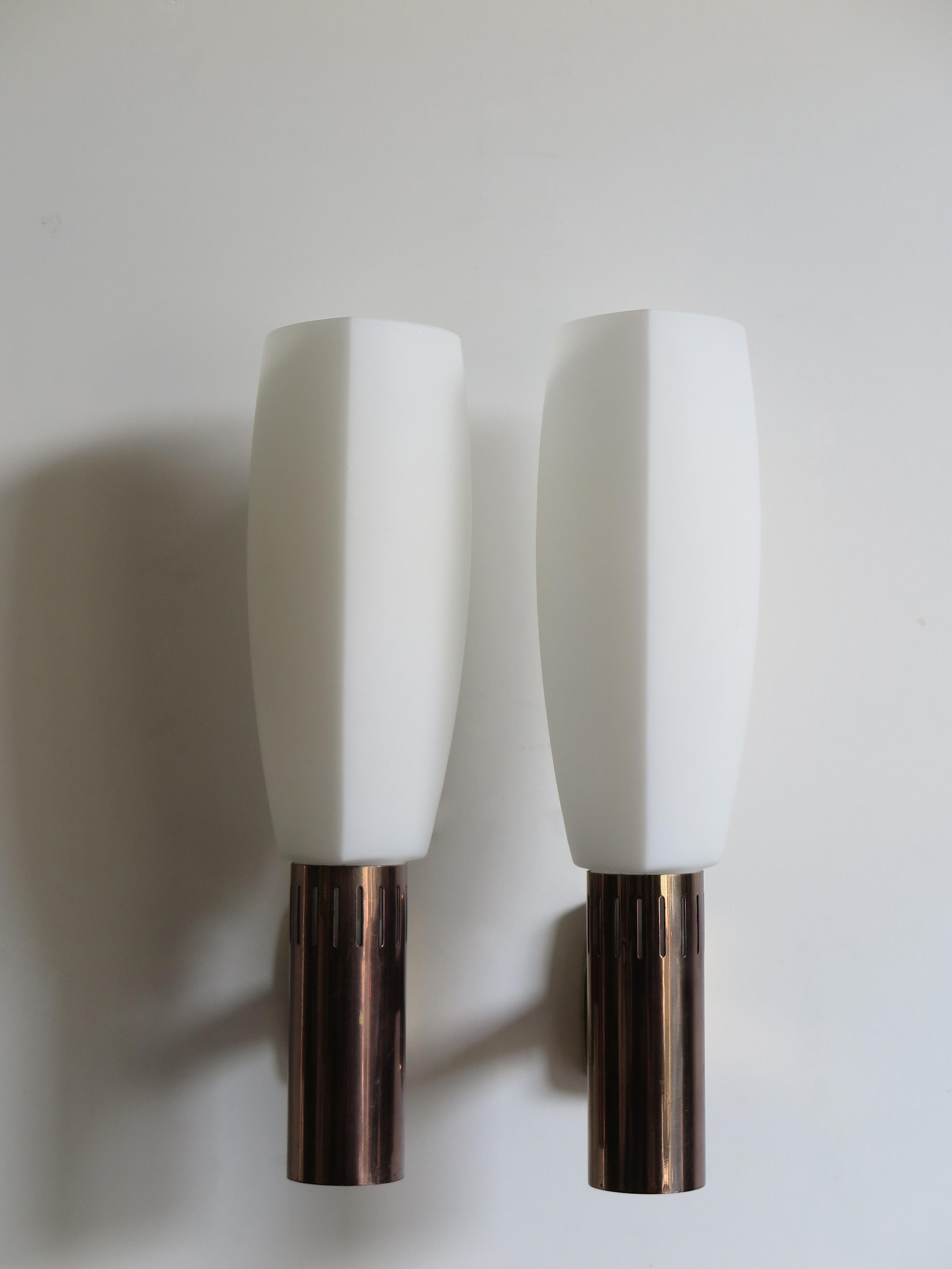 Couple of big Italian sconces / wall lamps produced by Stilnovo, 
with brass, burnished brass and frosted white opaline glass., circa1960s.
Engraved manufacturer’s mark and Stilnovo label, 1960s

Please note that the lamp is original of the