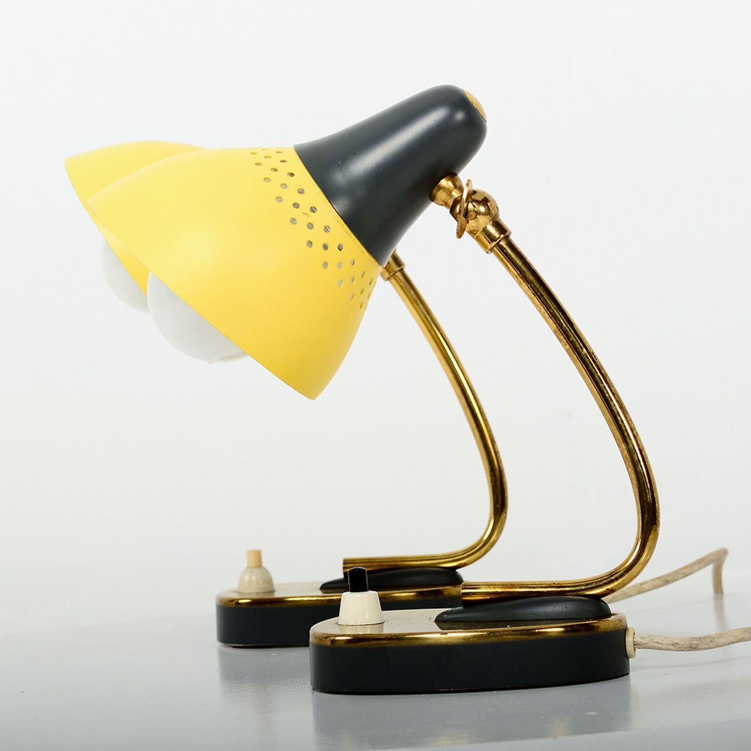 For your consideration, a pair of petite table lamps. Made in Italy. Attributed to Stilnovo. No label present, circa 1960s. Unique sassy sculptural shape with brass body. Shade is made of aluminum painted in yellow and dark gray. Shade is adjustable