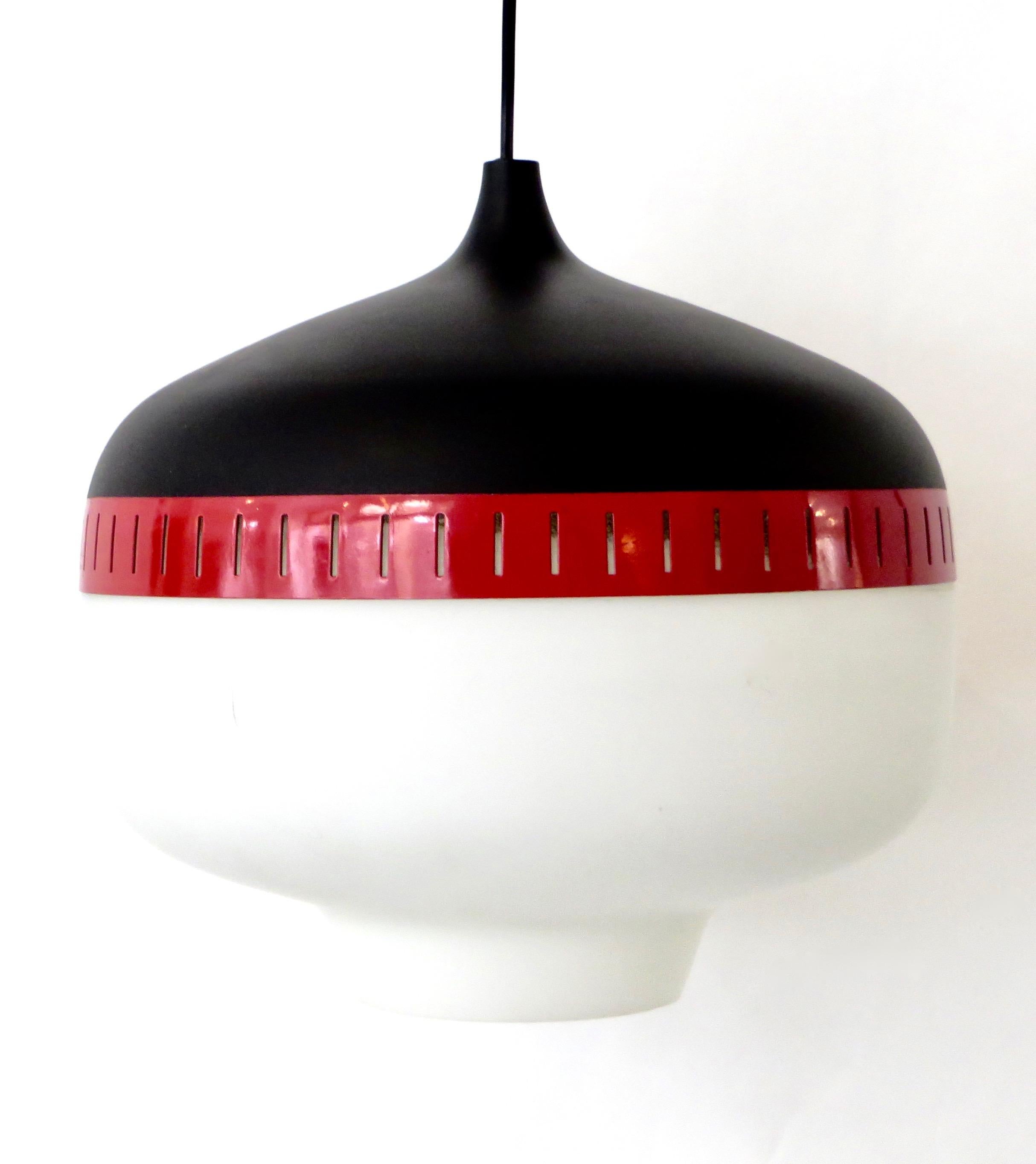 Pendant by Stilnovo designed and manufactured in Italy, circa 1960s.
Lacquered black and red metal shade with brushed satin opaque glass diffuser.
Perfect condition. Original ceiling cap.
Rewired for US junction boxes.
Takes one E27 100 w