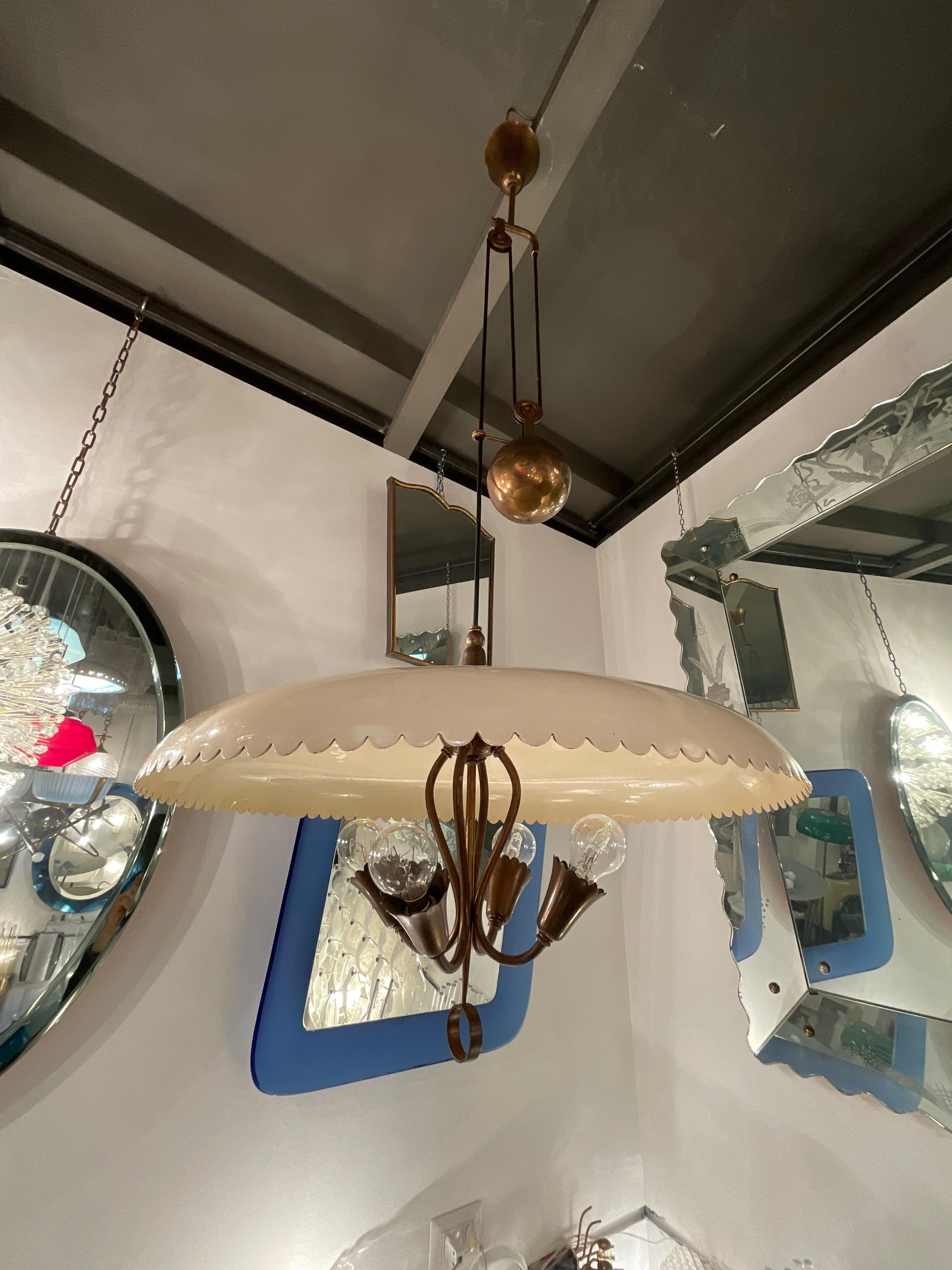 STILNOVO 1950 -  1 chandelier of quality materials and very functional and practical, to make the light reach the distance you want , and in the place you need it most.
The cream color of the metal diffuser and original of the era and the brass 