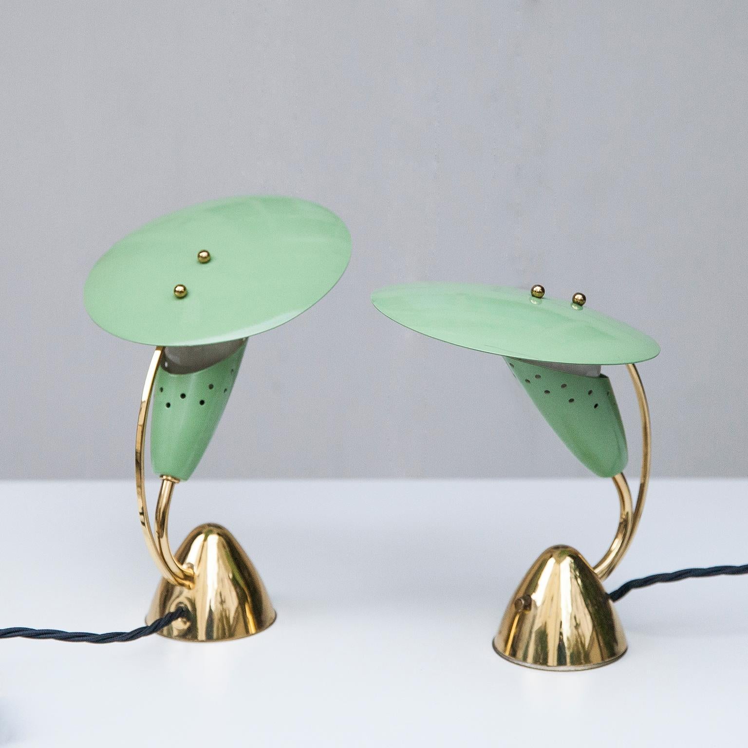 Nightstand table lamps in light green painted metal on an sculptural brass base, a extraordinary statement of the 1950s design.