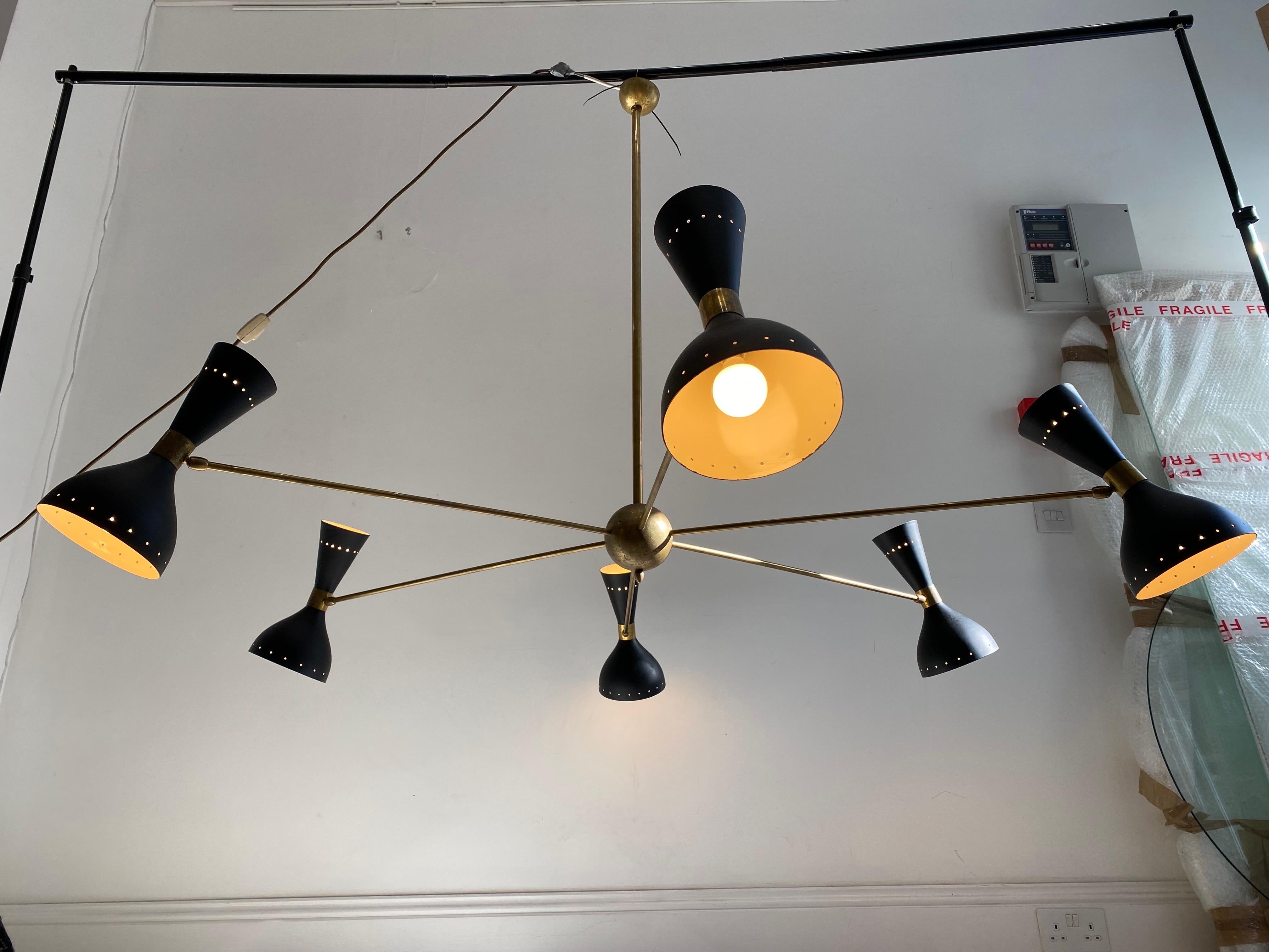 A classic ceiling lamp in the manner of Stilnovo. Please note this is not a modern copy, it's a 1970s italian lamp. Imported from a first buyer in a house in Greece where they imported it from Italy in the 1970s. Six arms, each arm takes two light