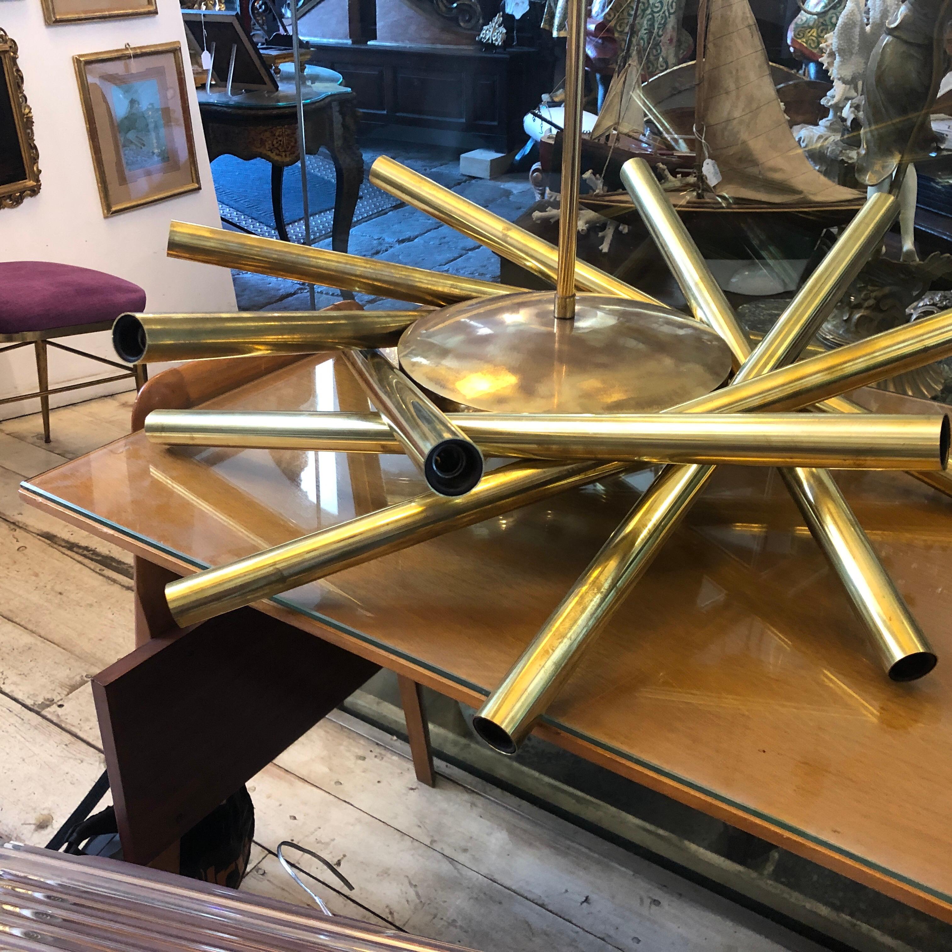 A Sputnik chandelier made in Italy in the 1950s by Stilnovo, brass has been cleaned but maintain its vibrant vintage look, original wiring, triple type of lighting, 8-light up, eight-light down and all together. It works 110-240 volts and need 16