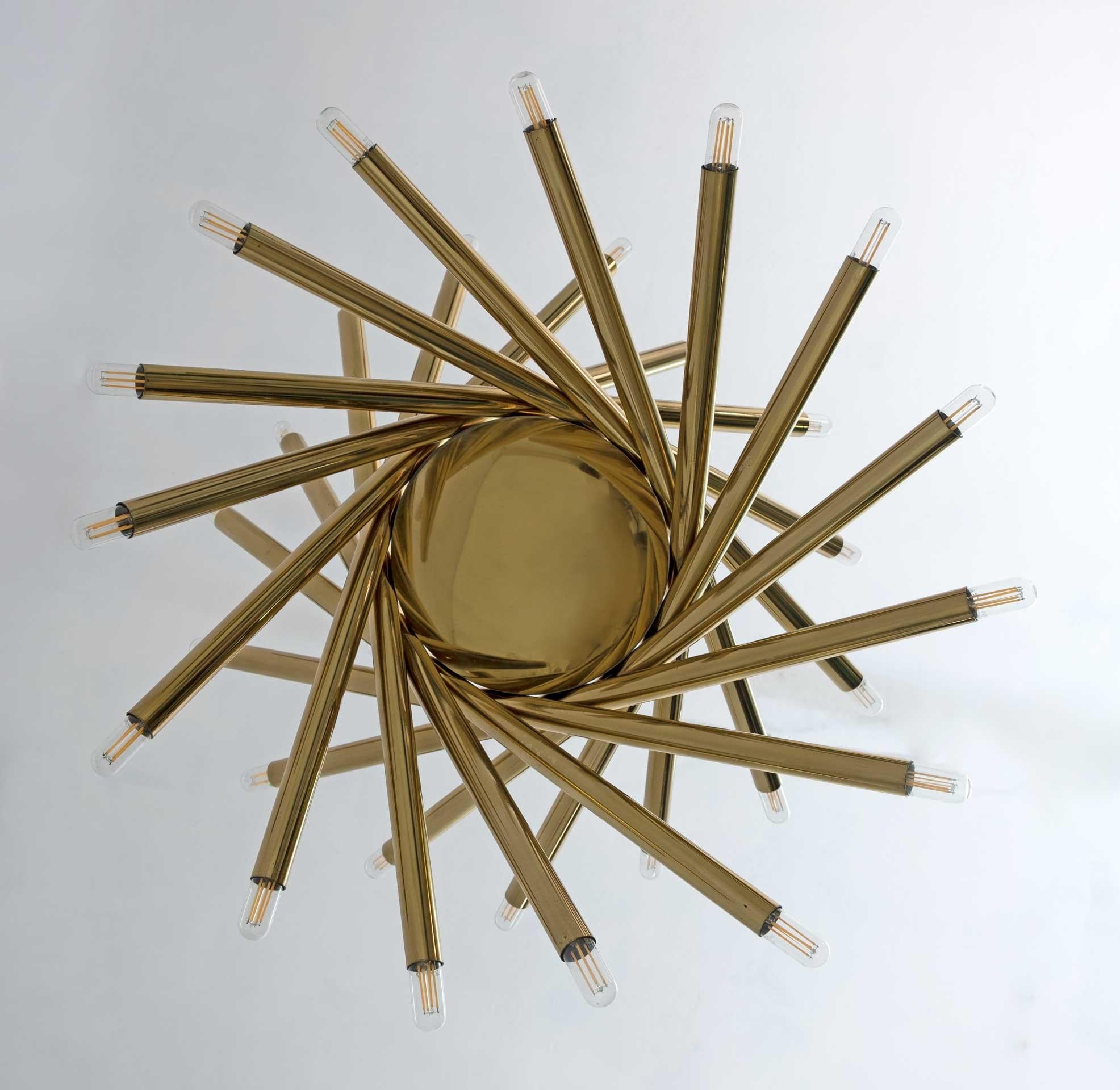Imposing brass chandelier by Stilnovo, Milan, 1960s. Thirty bulbs with E14 socket, with the reducers we can transform it into E12, USA socket. The last photo shows a smaller version of this fixture in Tamara Mellon's attic.
This version is very