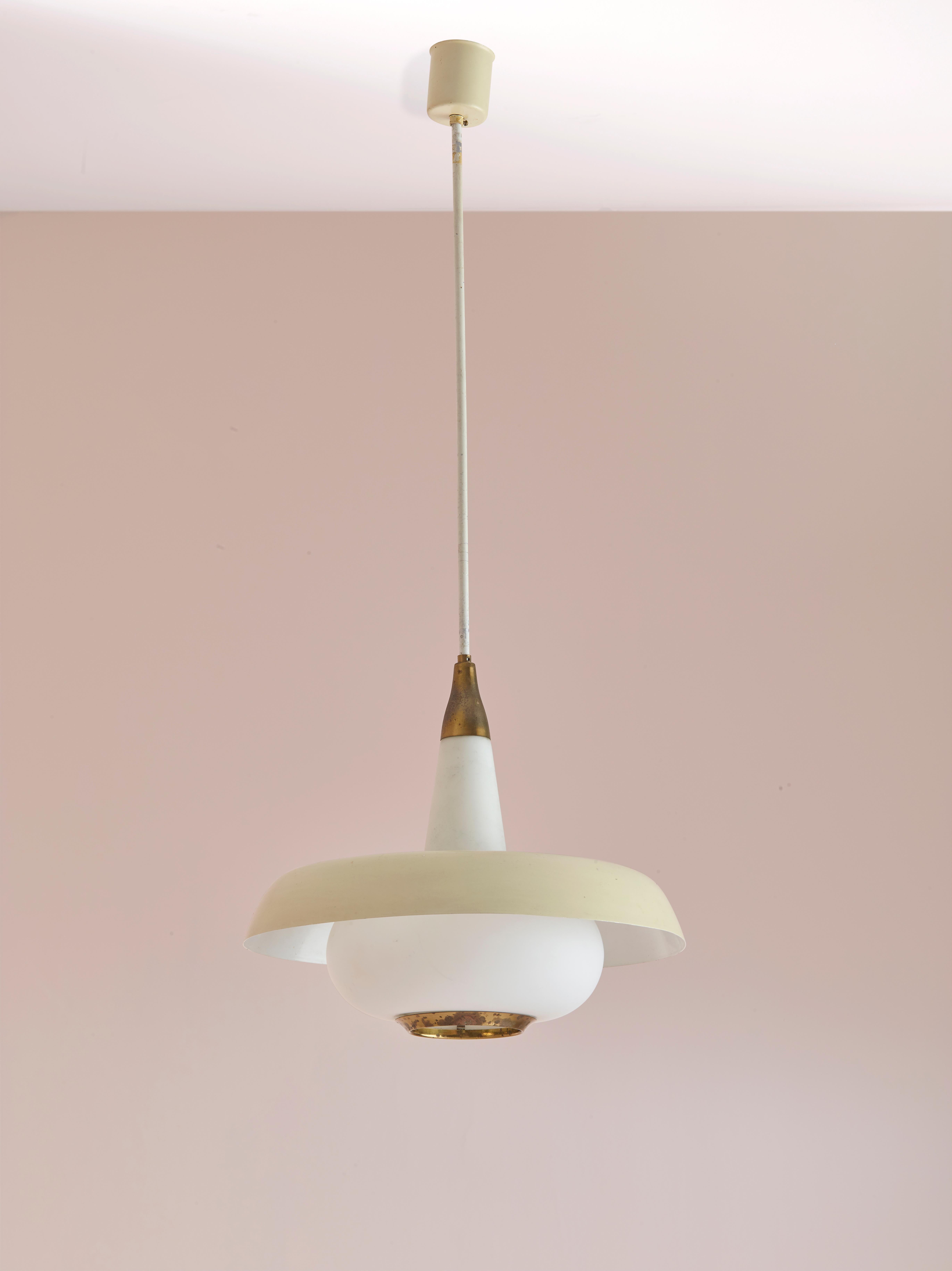 This elegant pendant light, attributed to the renowned Italian design company Stilnovo, is a beautiful example of Mid-Century Modern lighting design. Manufactured in the 1950s, it features an opaline glass diffuser and a milky white painted aluminum