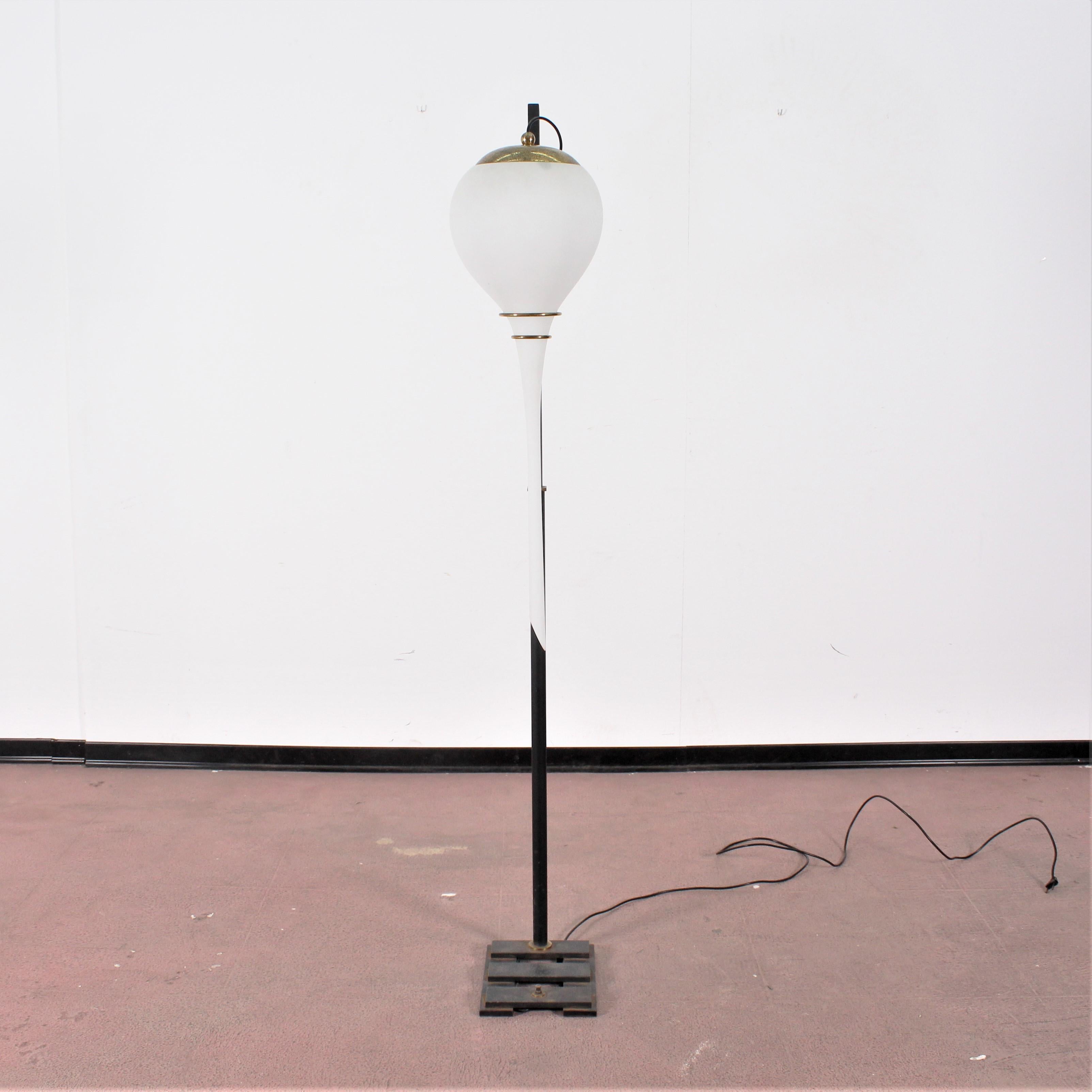 Stilnovo floor lamp designed and manufactured in Italy, 1950s. The lamp is made of metal and white opaline glass. 
Wear consistent with age and use.