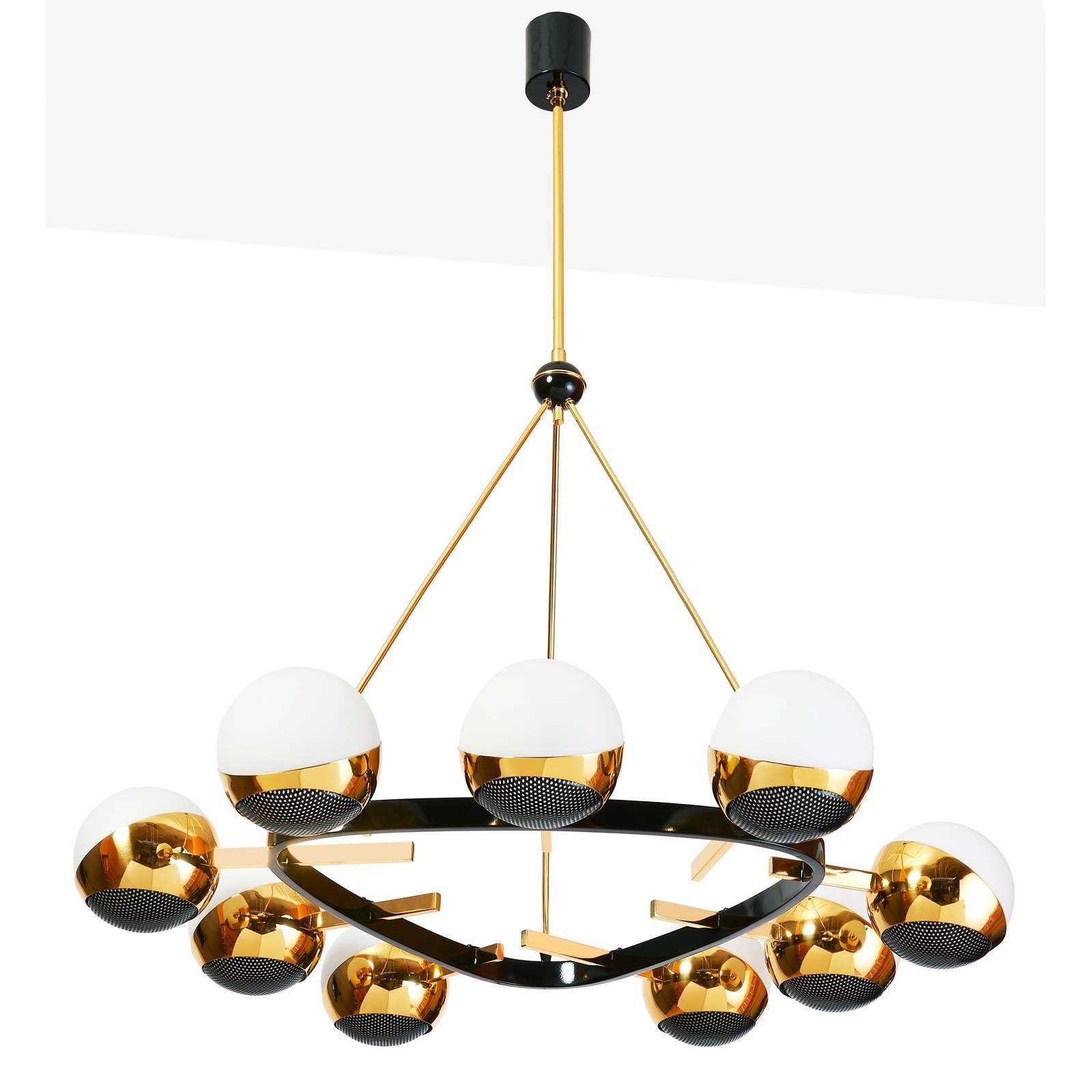 Stilnovo
Nine branch rounded triangular chandelier by Stilnovo in polished and black enameled brass, with opaline glass globes set in polished brass mounts with black enameled perforated screens. Italy, 1950s
Dimensions: 30 Diameter x 39 H as shown 