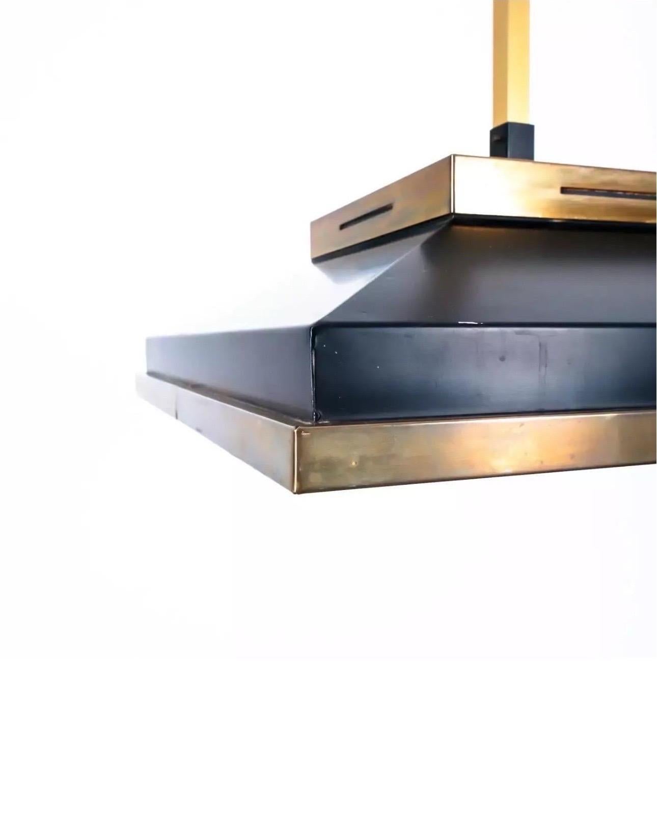 Stilnovo ceiling pendant fixture with a black aluminum and brass frame and opaline glass shade.

Italy, circa 1950.

Dimensions: 
25.6 inch drop height
20.5 inch width
20.5 inch length 

Good condition with light vintage wear to finish.  Hardwire