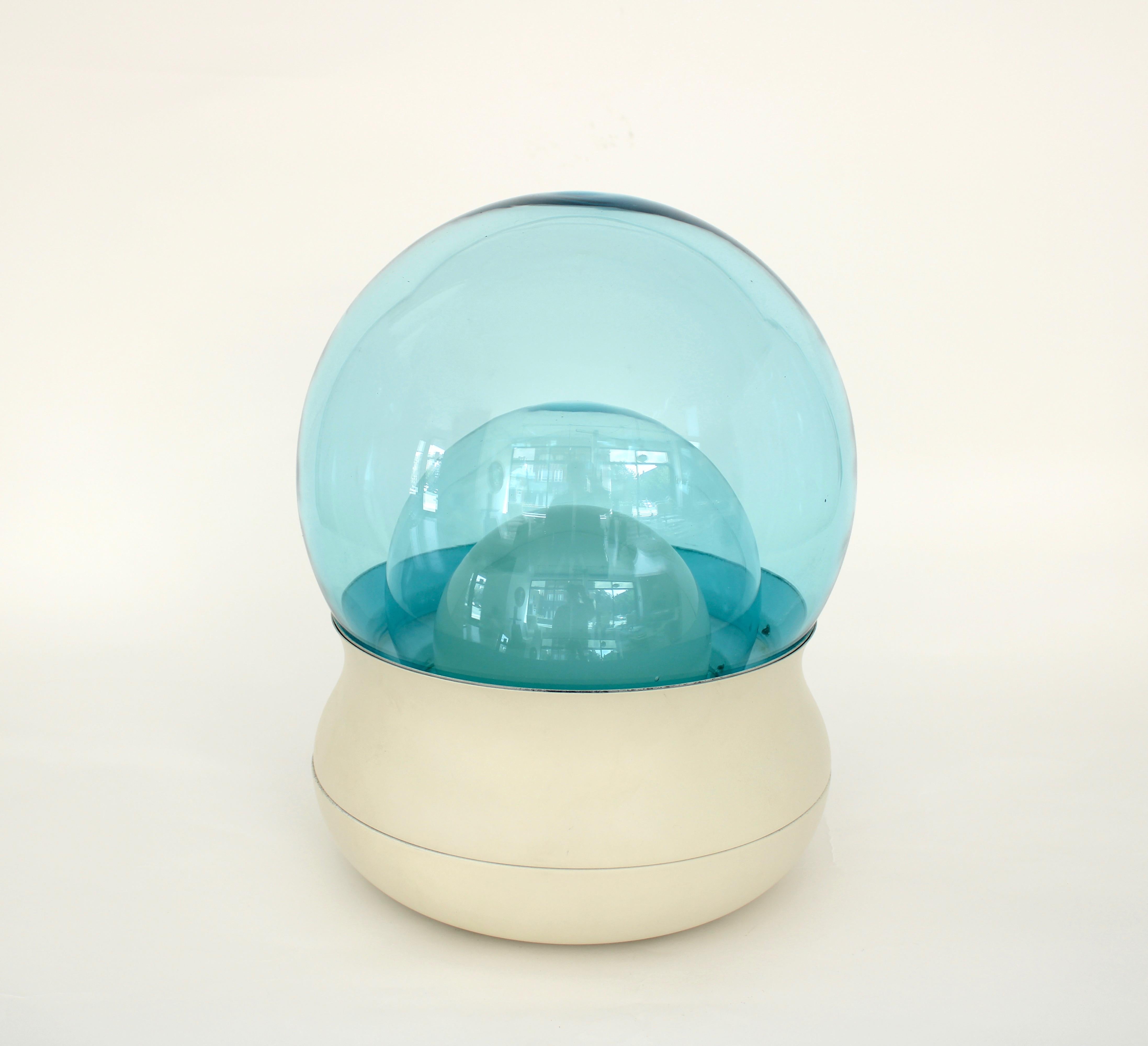 Stilnovo Italian glass table lamp with two blue glass domes over an opaque glass dome concealing a single bulb. This lamp presents as a light sculpture and also give off a nice ambient light. The blue of the glass is like a blue sky and the glass is