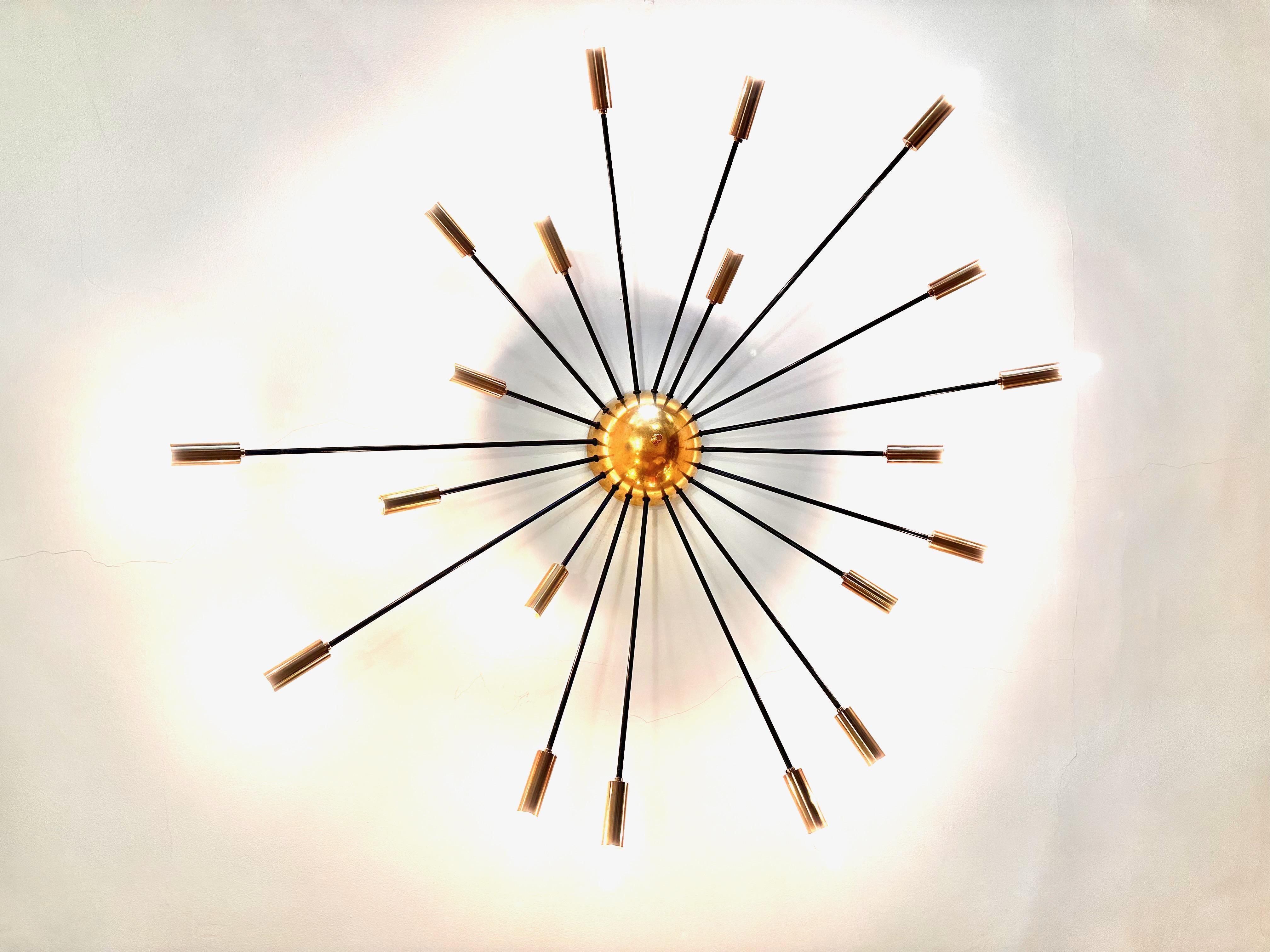 Huge and original brass sputnik plafond/chandelier produced by Stilnovo circa 1950.Twenty brass arms.Rewired for European/Usa E14 bulbs.Stunning condition,Brass cleaned and rewired.Beautiful patina.Fully original.Collection piece.
Free professional