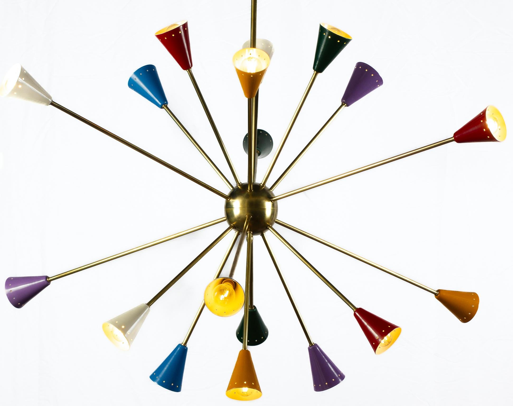 Features 18 brass arms, each sporting multicolored, perforated shades. Gold central sphere.
Bearing a circa 1970s label in the canopy.
Commonly called 'Sputnik' chandeliers today (in honor of the Russian satellite that inspired a war and a design