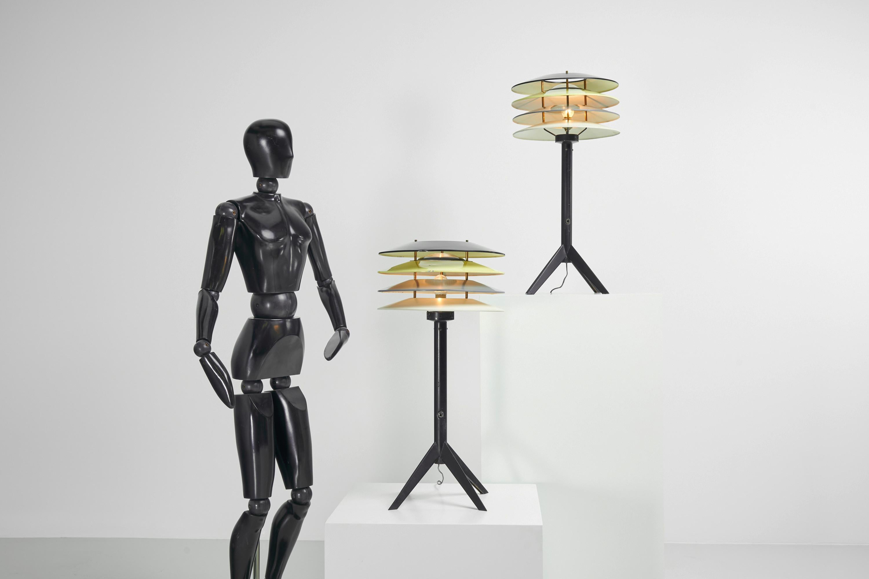 Absolutely fantastic and rare pair of floor lamps, designed and manufactured by Stilnovo, Italy 1955. These floor lamps have the look of an Art Deco outdoor lamp, they have a nice unusual size which could suit as a small floor lamp or large table