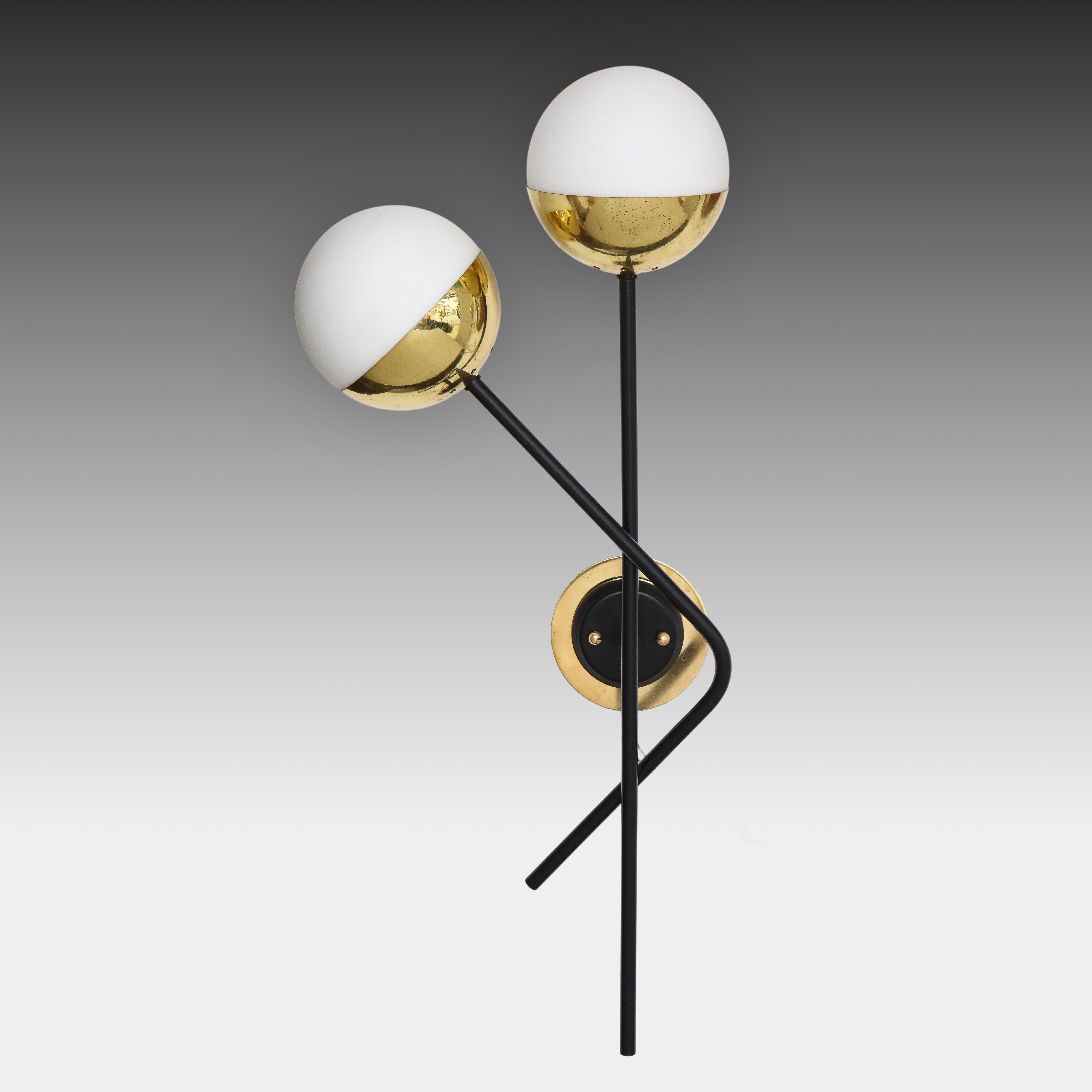 Stilnovo modernist pair of two-light sconces with opaque or frosted glass shades held in brass fittings suspended on black painted metal rods. These architectural wall lights are a classic Stilnovo design with striking contrasting signature colors