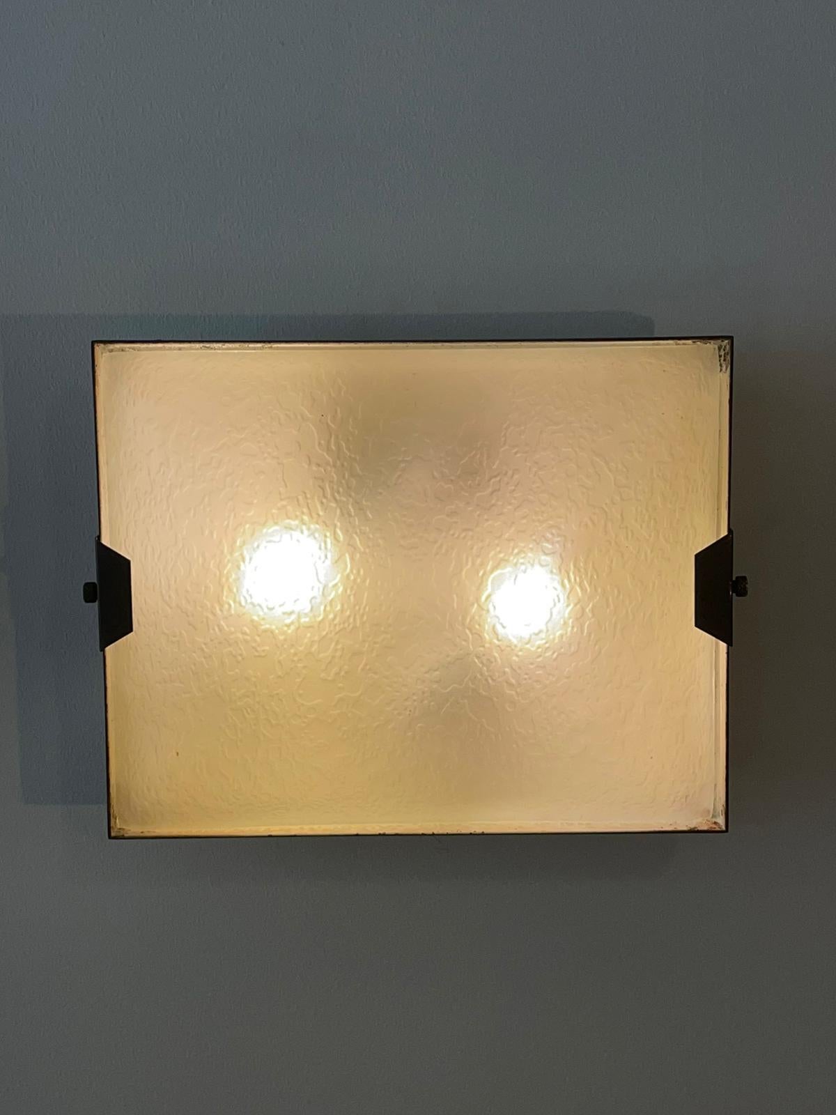 Pair of rectangular wall lamp manufactured by Stilnovo, Italy, 1950s
White lacquered metal structure and frosted glass.
In the back is present the stamp 