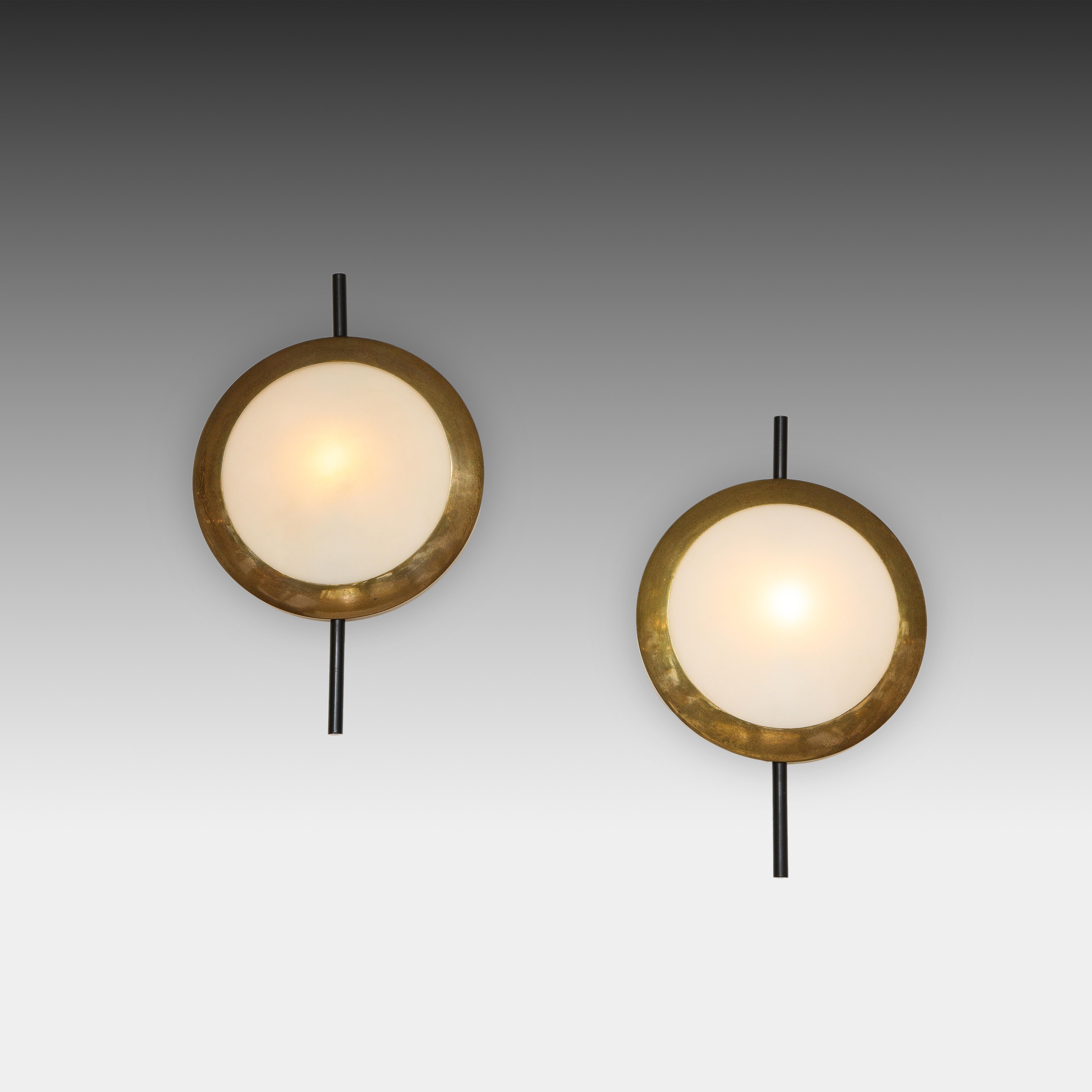 Stilnovo rare pairs of sconces with brass structure and opaline or frosted glass with black enameled metal rods, Italy, 1950s. Manufacturer's label 'STILNOVO' on interior of metal structure.
Price is per pair and set of four sconces available.
 